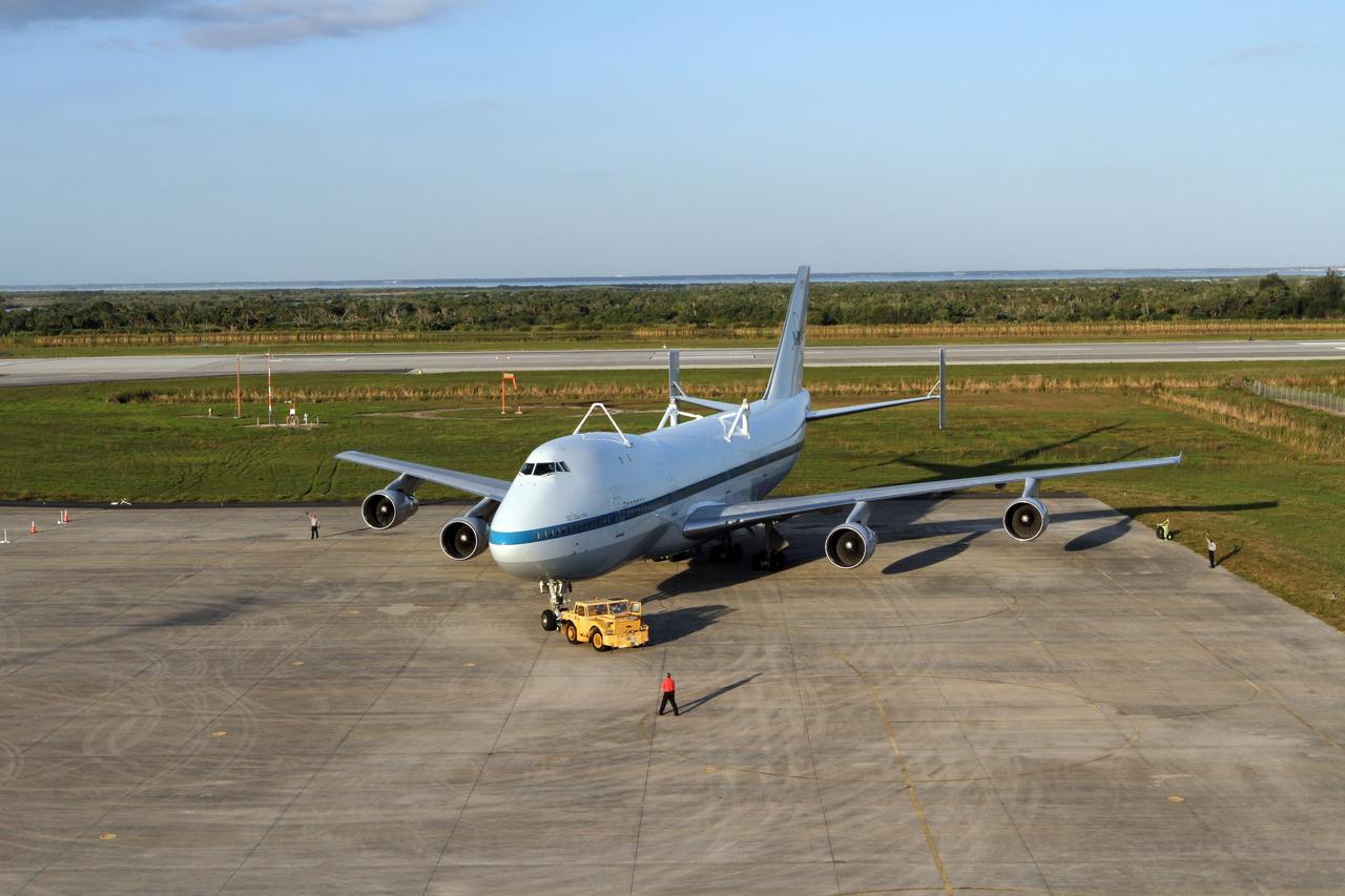 CAPE CANAVERAL, Fla. – At the Shuttle Landing Facility at NASA’s Kennedy Space Center in Florida, preparations are under way to tow a Shuttle Carrier Aircraft to the mate-demate device for mating with space shuttle Discovery. This SCA, designated NASA 905, is a Boeing 747 jet originally manufactured for commercial use, which was modified by NASA to transport the shuttles between destinations on Earth. NASA 905 is assigned to the remaining ferry missions, delivering the shuttles to their permanent public display sites. Discovery’s new home will be the Smithsonian's National Air and Space Museum Steven F. Udvar-Hazy Center in Chantilly, Va. For more information on the SCA, visit http://www.nasa.gov/centers/dryden/news/FactSheets/FS-013-DFRC.html. For more information on shuttle transition and retirement activities, visit http://www.nasa.gov/transition. Photo credit: NASA/Kim Shiflett