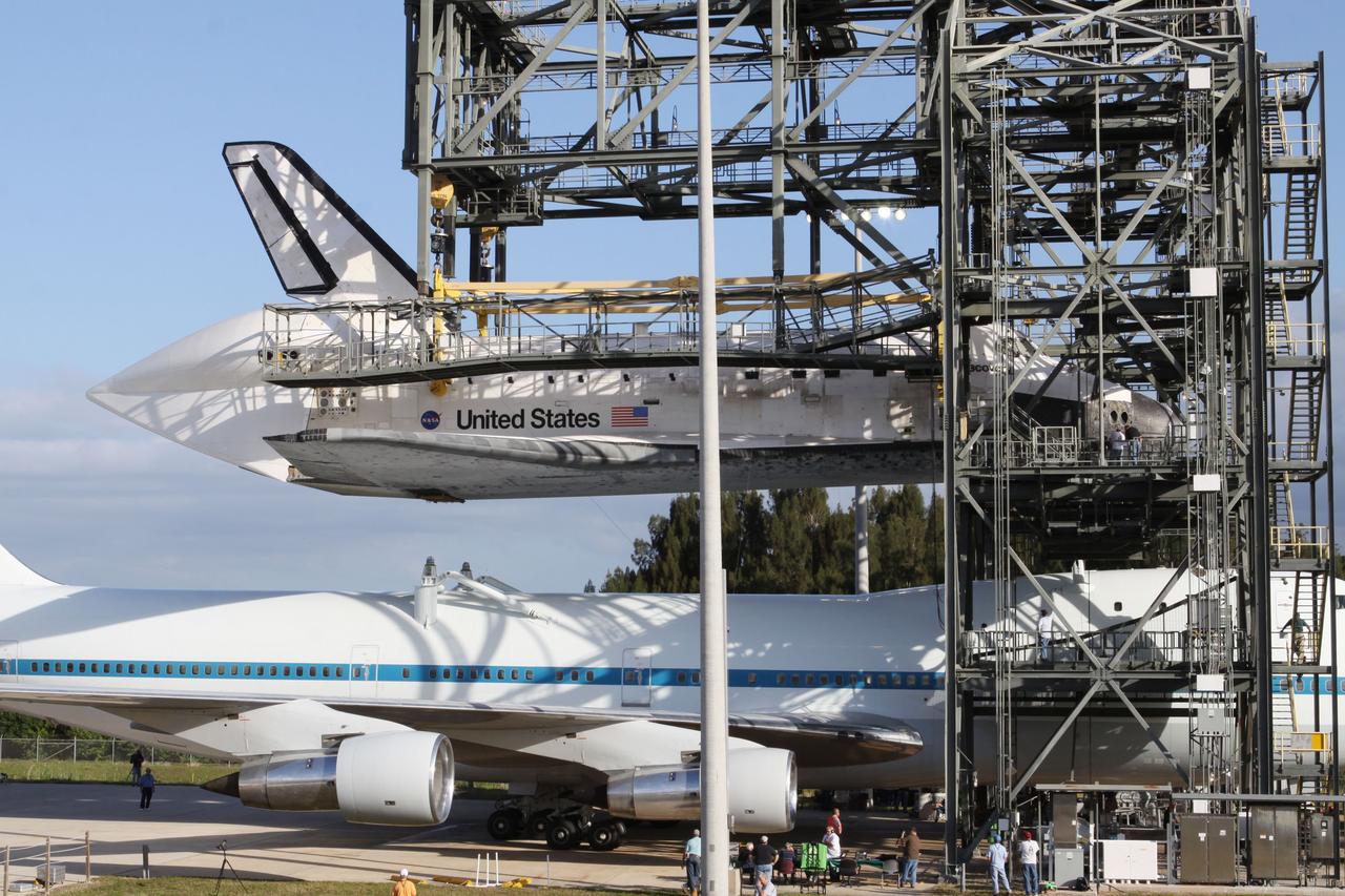 CAPE CANAVERAL, Fla. – At the Shuttle Landing Facility at NASA’s Kennedy Space Center in Florida, preparations are under way to lower space shuttle Discovery onto the Shuttle Carrier Aircraft in the mate-demate device.      The device, known as the MDD, is a large gantry-like steel structure used to hoist a shuttle off the ground and position it onto the back of the aircraft, or SCA. The SCA is a Boeing 747 jet, originally manufactured for commercial use, which was modified by NASA to transport the shuttles between destinations on Earth. The SCA designated NASA 905 is assigned to the remaining ferry missions, delivering the shuttles to their permanent public display sites.  NASA 905 is scheduled to ferry Discovery to the Washington Dulles International Airport in Virginia on April 17, after which the shuttle will be placed on display in the Smithsonian's National Air and Space Museum Steven F. Udvar-Hazy Center. For more information on the SCA, visit http://www.nasa.gov/centers/dryden/news/FactSheets/FS-013-DFRC.html. For more information on shuttle transition and retirement activities, visit http://www.nasa.gov/transition. Photo credit: NASA/Kim Shiflett