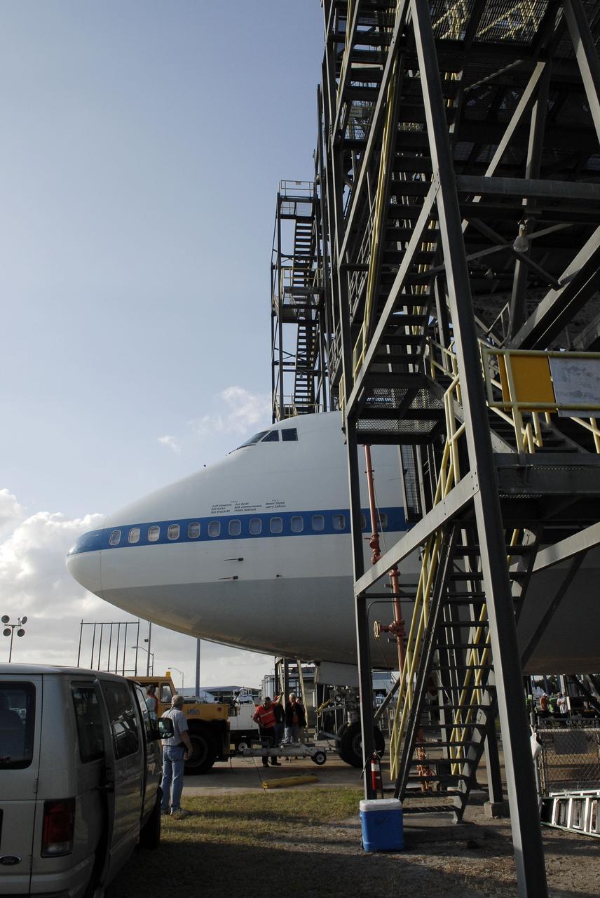 CAPE CANAVERAL, Fla. – At the Shuttle Landing Facility at NASA’s Kennedy Space Center in Florida, the Shuttle Carrier Aircraft is parked into position under space shuttle Discovery for mating operations to begin at the mate-demate device.      The device, known as the MDD, is a large gantry-like steel structure used to hoist a shuttle off the ground and position it onto the back of the aircraft, or SCA. The SCA is a Boeing 747 jet, originally manufactured for commercial use, which was modified by NASA to transport the shuttles between destinations on Earth. This SCA, designated NASA 905, is assigned to the remaining ferry missions, delivering the shuttles to their permanent public display sites.  NASA 905 is scheduled to ferry Discovery to the Washington Dulles International Airport in Virginia on April 17, after which the shuttle will be placed on display in the Smithsonian's National Air and Space Museum Steven F. Udvar-Hazy Center. For more information on the SCA, visit http://www.nasa.gov/centers/dryden/news/FactSheets/FS-013-DFRC.html. For more information on shuttle transition and retirement activities, visit http://www.nasa.gov/transition. Photo credit: NASA/Tim Jacobs