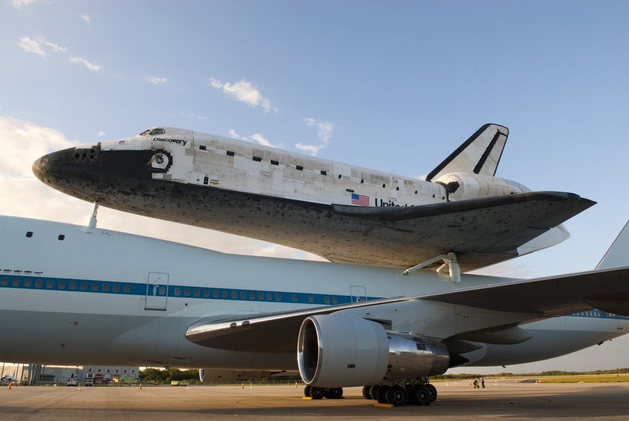 CAPE CANAVERAL, Fla. – At the Shuttle Landing Facility at NASA’s Kennedy Space Center in Florida, space shuttle Discovery is firmly attached to the back of a Shuttle Carrier Aircraft, awaiting departure from Kennedy in the morning.    The aircraft, also known as an SCA, is a Boeing 747 jet, originally manufactured for commercial use, which was modified by NASA to transport the shuttles between destinations on Earth. The SCA designated NASA 905 is assigned to the remaining ferry missions, delivering the shuttles to their permanent public display sites.  NASA 905 is scheduled to ferry Discovery to the Washington Dulles International Airport in Virginia on April 17, after which the shuttle will be placed on display in the Smithsonian's National Air and Space Museum Steven F. Udvar-Hazy Center. For more information on the SCA, visit http://www.nasa.gov/centers/dryden/news/FactSheets/FS-013-DFRC.html. For more information on shuttle transition and retirement activities, visit http://www.nasa.gov/transition. Photo credit: NASA/Tim Jacobs