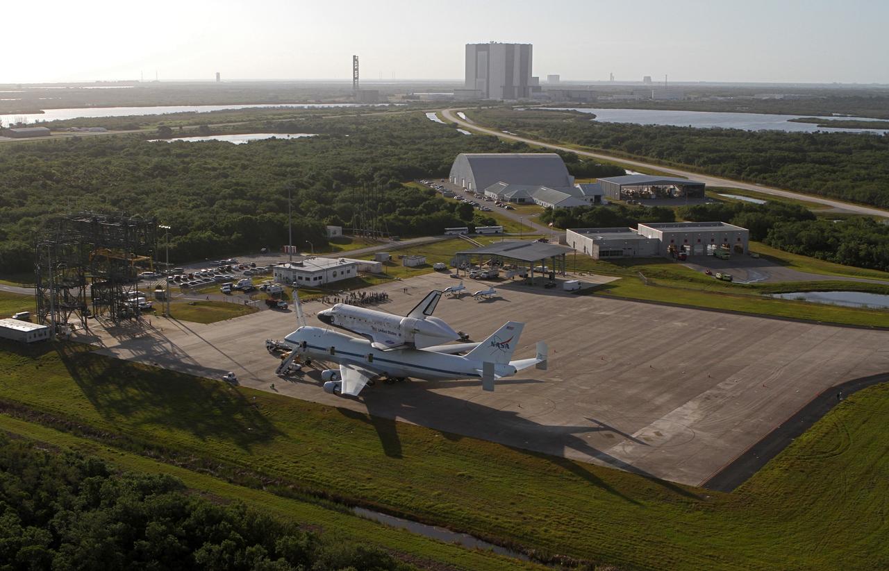 CAPE CANAVERAL, Fla. – This is an aerial view of space shuttle Discovery bolted to the top of a Shuttle Carrier Aircraft SCA on the ramp of the Shuttle Landing Facility SLF at NASA’s Kennedy Space Center in Florida. Discovery's last crew members are expected to be at the SLF, along with Kennedy employees and guests, as the center says goodbye to the agency's most-flown shuttle on April 17. The SCA, designated NASA 905, will ferry Discovery to the Washington Dulles International Airport in Virginia, after which the shuttle will be moved for public display in the Smithsonian's National Air and Space Museum Steven F. Udvar-Hazy Center on April 19.          For more information on the SCA, visit http://www.nasa.gov/centers/dryden/news/FactSheets/FS-013-DFRC.html. For more information on shuttle transition and retirement activities, visit http://www.nasa.gov/transition. Photo credit: NASA/Kim Shiflett