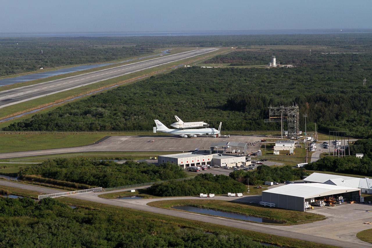 CAPE CANAVERAL, Fla. – This is an aerial view of the long Shuttle Landing Facility SLF runway at NASA's Kennedy Space Center in Florida that space shuttle Discovery, bolted to the top of a Shuttle Carrier Aircraft SCA, will take off from on April 17. Discovery's last crew members are expected to be at the runway, along with Kennedy employees and guests, as the center says goodbye to the agency's most-flown shuttle. The SCA, designated NASA 905, will ferry Discovery to the Washington Dulles International Airport in Virginia, after which the shuttle will be moved for public display in the Smithsonian's National Air and Space Museum Steven F. Udvar-Hazy Center on April 19.          For more information on the SCA, visit http://www.nasa.gov/centers/dryden/news/FactSheets/FS-013-DFRC.html. For more information on shuttle transition and retirement activities, visit http://www.nasa.gov/transition. Photo credit: NASA/Kim Shiflett