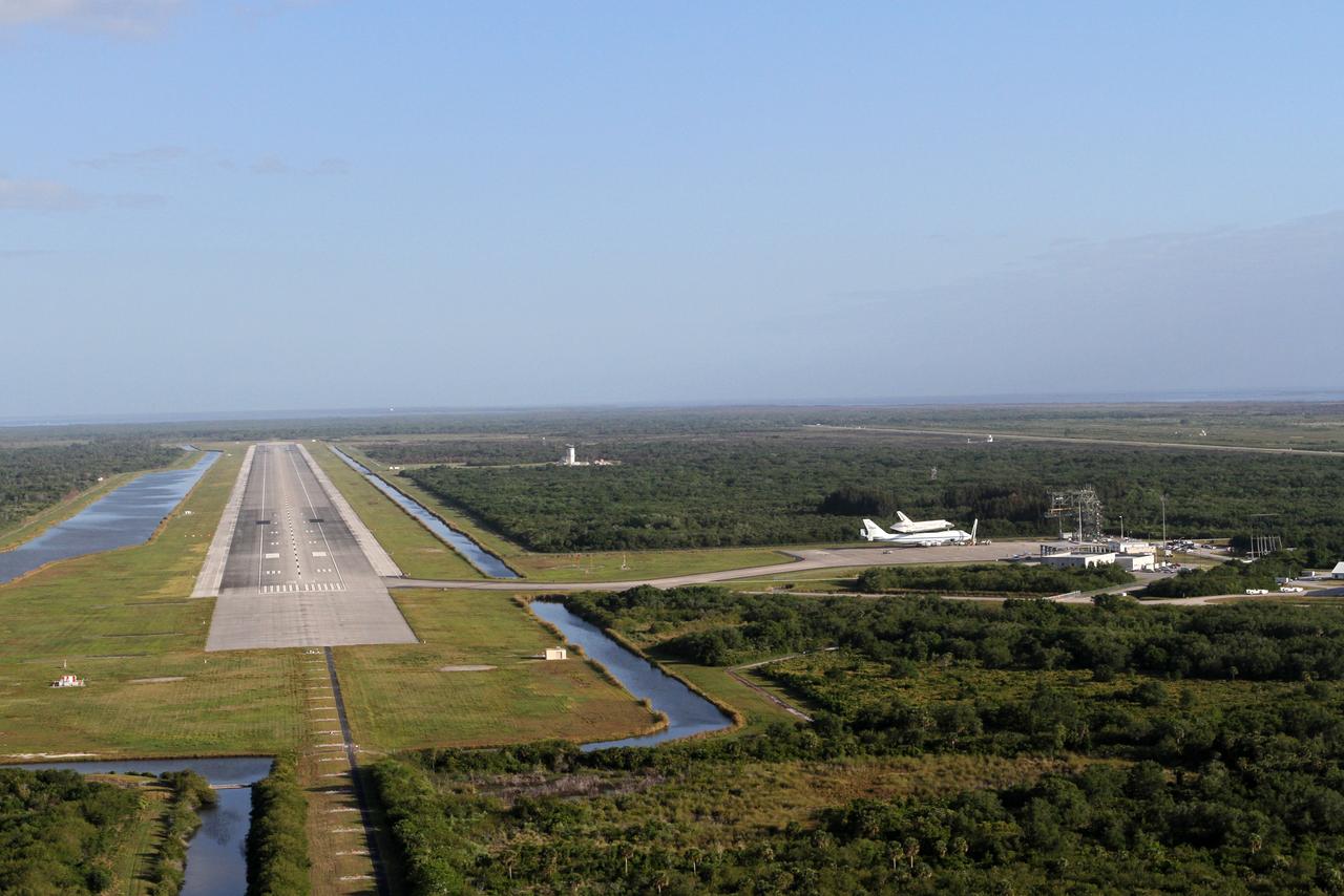 CAPE CANAVERAL, Fla. – This is an aerial view of the long Shuttle Landing Facility SLF runway at NASA's Kennedy Space Center in Florida that space shuttle Discovery, bolted to the top of a Shuttle Carrier Aircraft SCA, will take off from on April 17. Discovery's last crew members are expected to be at the runway, along with Kennedy employees and guests, as the center says goodbye to the agency's most-flown shuttle. The SCA, designated NASA 905, will ferry Discovery to the Washington Dulles International Airport in Virginia, after which the shuttle will be moved for public display in the Smithsonian's National Air and Space Museum Steven F. Udvar-Hazy Center on April 19.        For more information on the SCA, visit http://www.nasa.gov/centers/dryden/news/FactSheets/FS-013-DFRC.html. For more information on shuttle transition and retirement activities, visit http://www.nasa.gov/transition. Photo credit: NASA/Kim Shiflett