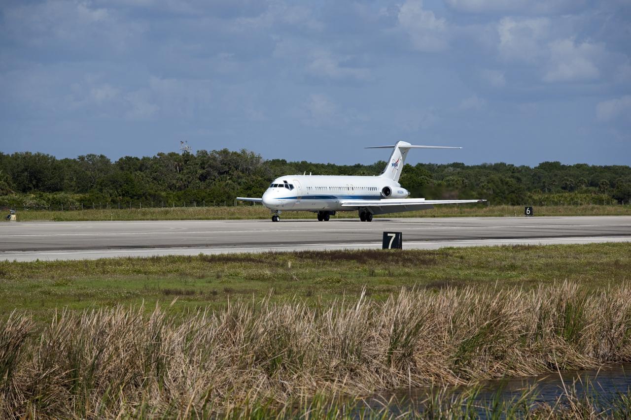 CAPE CANAVERAL, Fla. – The “pathfinder” aircraft for space shuttle Discovery’s ferry flight lands at the Shuttle Landing Facility at NASA’s Kennedy Space Center in Florida. The NASA C-9 aircraft will fly about 100 miles ahead of Discovery to scout for the safest route between destinations. Its crew includes an SCA flight engineer who studies the weather patterns along the flight path to find a route free of rain and other turbulence. The carrier aircraft, also known as an SCA, is a Boeing 747 jet, originally manufactured for commercial use which was modified by NASA to transport the shuttles between destinations on Earth. NASA 905 is scheduled to ferry Discovery to the Washington Dulles International Airport in Virginia on April 17, and is assigned to all remaining ferry missions, delivering the shuttles to their permanent public display sites. After its arrival at Dulles, Discovery will be placed on display in the Smithsonian's National Air and Space Museum Steven F. Udvar-Hazy Center on April 19. For more information on the SCA, visit http://www.nasa.gov/centers/dryden/news/FactSheets/FS-013-DFRC.html. For more information on shuttle transition and retirement activities, visit http://www.nasa.gov/transition. Photo credit: NASA/Amanda Diller