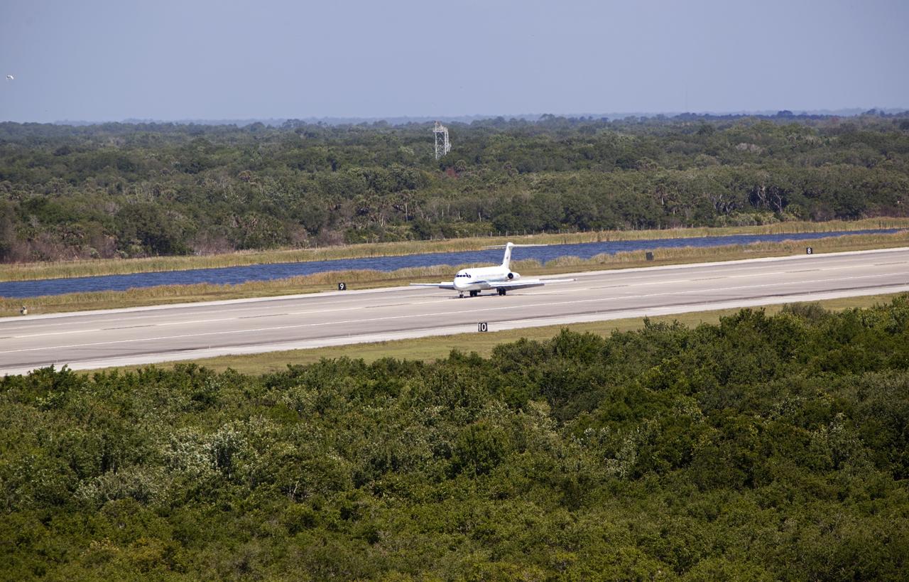 CAPE CANAVERAL, Fla. – The “pathfinder” aircraft for space shuttle Discovery’s ferry flight touches down at the Shuttle Landing Facility at NASA’s Kennedy Space Center in Florida. The NASA C-9 aircraft will fly about 100 miles ahead of Discovery to scout for the safest route between destinations. Its crew includes an SCA flight engineer who studies the weather patterns along the flight path to find a route free of rain and other turbulence. The carrier aircraft, also known as an SCA, is a Boeing 747 jet, originally manufactured for commercial use which was modified by NASA to transport the shuttles between destinations on Earth. NASA 905 is scheduled to ferry Discovery to the Washington Dulles International Airport in Virginia on April 17, and is assigned to all remaining ferry missions, delivering the shuttles to their permanent public display sites. After its arrival at Dulles, Discovery will be placed on display in the Smithsonian's National Air and Space Museum Steven F. Udvar-Hazy Center on April 19. For more information on the SCA, visit http://www.nasa.gov/centers/dryden/news/FactSheets/FS-013-DFRC.html. For more information on shuttle transition and retirement activities, visit http://www.nasa.gov/transition. Photo credit: NASA/Dimitri Gerondidaki