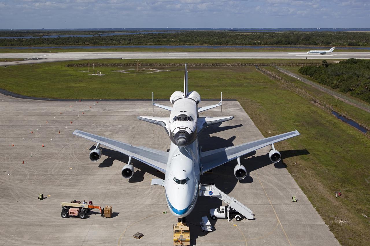 CAPE CANAVERAL, Fla. – Preparations for space shuttle Discovery’s ferry flight aboard a Shuttle Carrier Aircraft continue as the “pathfinder” aircraft for the flight lands at the Shuttle Landing Facility at NASA’s Kennedy Space Center in Florida. The NASA C-9 aircraft will fly about 100 miles ahead of Discovery to scout for the safest route between destinations. Its crew includes an SCA flight engineer who studies the weather patterns along the flight path to find a route free of rain and other turbulence. The carrier aircraft, also known as an SCA, is a Boeing 747 jet, originally manufactured for commercial use which was modified by NASA to transport the shuttles between destinations on Earth. NASA 905 is scheduled to ferry Discovery to the Washington Dulles International Airport in Virginia on April 17, and is assigned to all remaining ferry missions, delivering the shuttles to their permanent public display sites. After its arrival at Dulles, Discovery will be placed on display in the Smithsonian's National Air and Space Museum Steven F. Udvar-Hazy Center on April 19. For more information on the SCA, visit http://www.nasa.gov/centers/dryden/news/FactSheets/FS-013-DFRC.html. For more information on shuttle transition and retirement activities, visit http://www.nasa.gov/transition. Photo credit: NASA/Dimitri Gerondidaki