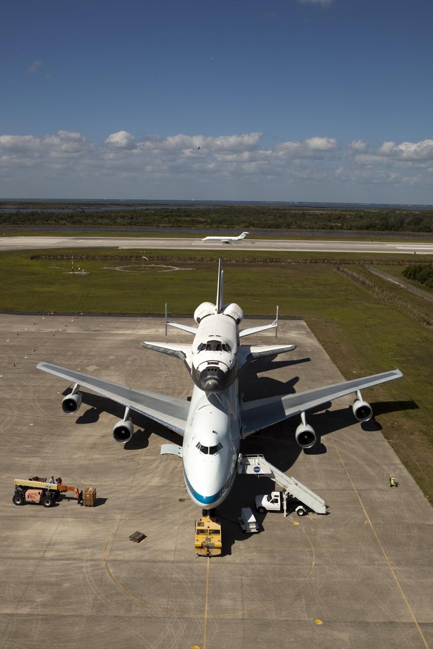 CAPE CANAVERAL, Fla. – Preparations for space shuttle Discovery’s ferry flight aboard a Shuttle Carrier Aircraft continue as the “pathfinder” aircraft for the flight lands at the Shuttle Landing Facility at NASA’s Kennedy Space Center in Florida. The NASA C-9 aircraft will fly about 100 miles ahead of Discovery to scout for the safest route between destinations. Its crew includes an SCA flight engineer who studies the weather patterns along the flight path to find a route free of rain and other turbulence. The carrier aircraft, also known as an SCA, is a Boeing 747 jet, originally manufactured for commercial use which was modified by NASA to transport the shuttles between destinations on Earth. NASA 905 is scheduled to ferry Discovery to the Washington Dulles International Airport in Virginia on April 17, and is assigned to all remaining ferry missions, delivering the shuttles to their permanent public display sites. After its arrival at Dulles, Discovery will be placed on display in the Smithsonian's National Air and Space Museum Steven F. Udvar-Hazy Center on April 19. For more information on the SCA, visit http://www.nasa.gov/centers/dryden/news/FactSheets/FS-013-DFRC.html. For more information on shuttle transition and retirement activities, visit http://www.nasa.gov/transition. Photo credit: NASA/Dimitri Gerondidaki