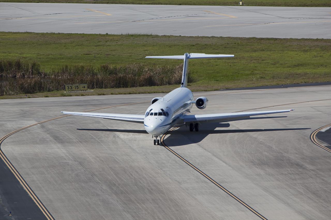 CAPE CANAVERAL, Fla. – The “pathfinder” aircraft for space shuttle Discovery’s ferry flight taxis onto the apron of the Shuttle Landing Facility at NASA’s Kennedy Space Center in Florida. The NASA C-9 aircraft will fly about 100 miles ahead of Discovery to scout for the safest route between destinations. Its crew includes an SCA flight engineer who studies the weather patterns along the flight path to find a route free of rain and other turbulence. The carrier aircraft, also known as an SCA, is a Boeing 747 jet, originally manufactured for commercial use which was modified by NASA to transport the shuttles between destinations on Earth. NASA 905 is scheduled to ferry Discovery to the Washington Dulles International Airport in Virginia on April 17, and is assigned to all remaining ferry missions, delivering the shuttles to their permanent public display sites. After its arrival at Dulles, Discovery will be placed on display in the Smithsonian's National Air and Space Museum Steven F. Udvar-Hazy Center on April 19. For more information on the SCA, visit http://www.nasa.gov/centers/dryden/news/FactSheets/FS-013-DFRC.html. For more information on shuttle transition and retirement activities, visit http://www.nasa.gov/transition. Photo credit: NASA/Dimitri Gerondidaki