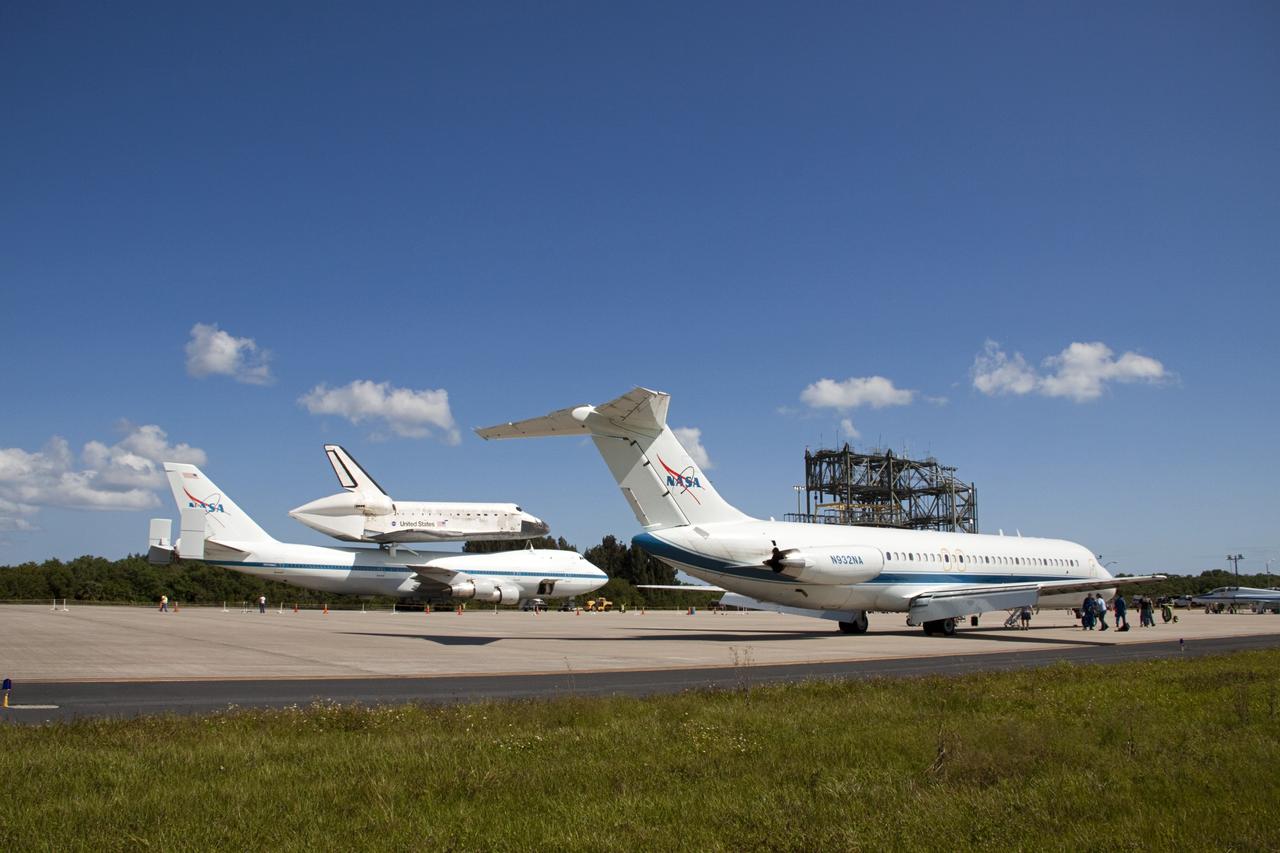CAPE CANAVERAL, Fla. – A buzz of activity surrounds the “pathfinder” aircraft for space shuttle Discovery’s ferry flight on the tarmac of the Shuttle Landing Facility at NASA’s Kennedy Space Center in Florida. The NASA C-9 aircraft will fly about 100 miles ahead of Discovery to scout for the safest route between destinations. Its crew includes an SCA flight engineer who studies the weather patterns along the flight path to find a route free of rain and other turbulence. The carrier aircraft, also known as an SCA, is a Boeing 747 jet, originally manufactured for commercial use which was modified by NASA to transport the shuttles between destinations on Earth. NASA 905 is scheduled to ferry Discovery to the Washington Dulles International Airport in Virginia on April 17, and is assigned to all remaining ferry missions, delivering the shuttles to their permanent public display sites. After its arrival at Dulles, Discovery will be placed on display in the Smithsonian's National Air and Space Museum Steven F. Udvar-Hazy Center on April 19. For more information on the SCA, visit http://www.nasa.gov/centers/dryden/news/FactSheets/FS-013-DFRC.html. For more information on shuttle transition and retirement activities, visit http://www.nasa.gov/transition. Photo credit: NASA/Amanda Diller