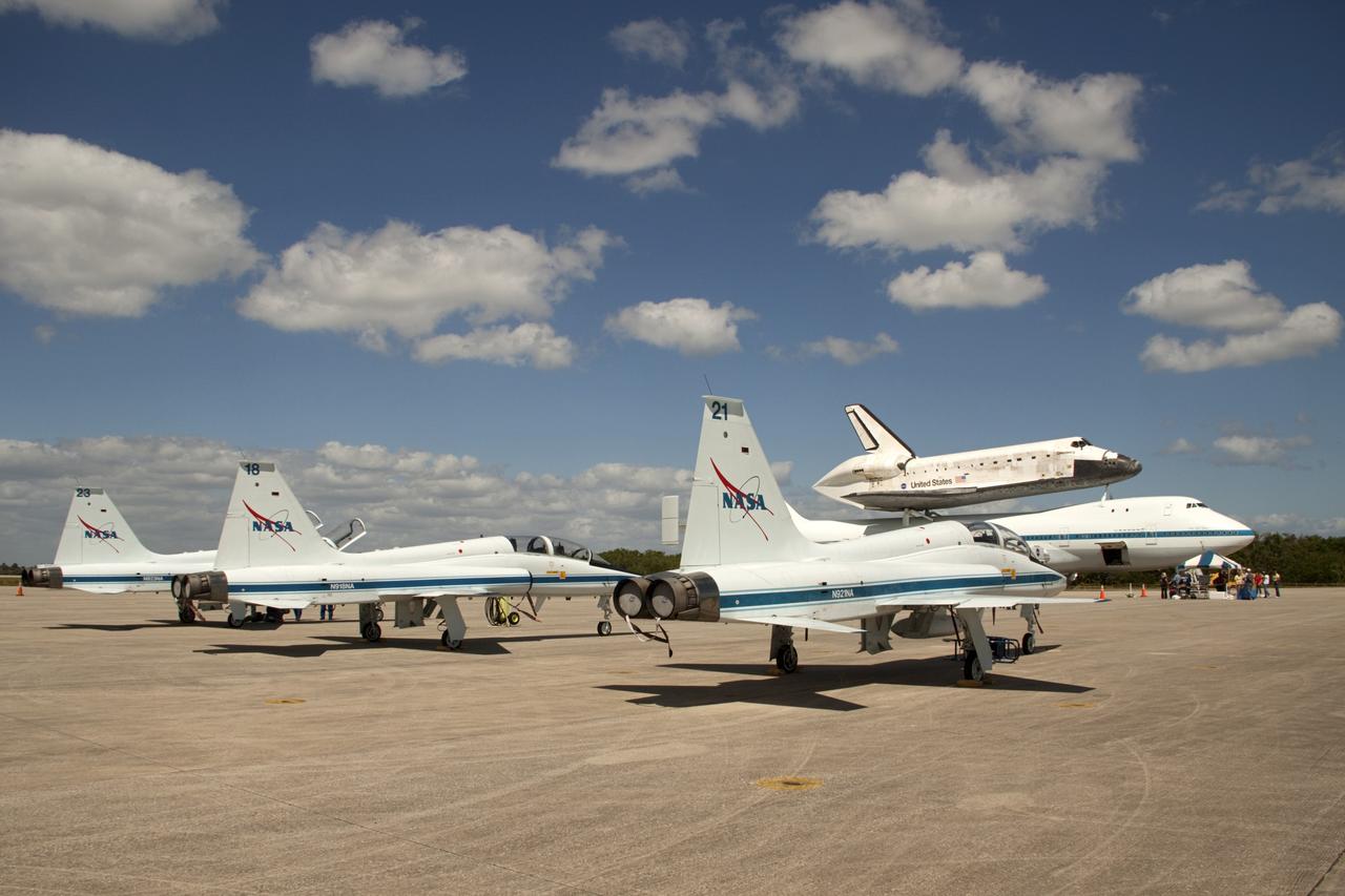 CAPE CANAVERAL, Fla. – It’s a full house on the tarmac at the Shuttle Landing Facility at NASA’s Kennedy Space Center in Florida with the arrival of astronauts in T-38 jets, the “pathfinder” aircraft for space shuttle Discovery’s ferry flight and the Shuttle Carrier Aircraft with Discovery secured on its back. The astronauts are participating in the festivities related to the final departure of Discovery from Kennedy. The NASA C-9 pathfinder aircraft will fly about 100 miles ahead of Discovery to scout for the safest route between destinations. Its crew includes an SCA flight engineer who studies the weather patterns along the flight path to find a route free of rain and other turbulence. The carrier aircraft, also known as an SCA, is a Boeing 747 jet, originally manufactured for commercial use which was modified by NASA to transport the shuttles between destinations on Earth. NASA 905 is scheduled to ferry Discovery to the Washington Dulles International Airport in Virginia on April 17, and is assigned to all remaining ferry missions, delivering the shuttles to their permanent public display sites. After its arrival at Dulles, Discovery will be placed on display in the Smithsonian's National Air and Space Museum Steven F. Udvar-Hazy Center on April 19. For more information on the SCA, visit http://www.nasa.gov/centers/dryden/news/FactSheets/FS-013-DFRC.html. For more information on shuttle transition and retirement activities, visit http://www.nasa.gov/transition. Photo credit: NASA/Amanda Diller