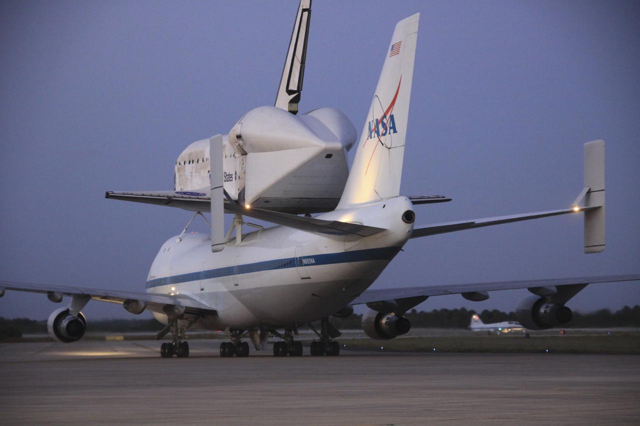 CAPE CANAVERAL, Fla. – The Shuttle Carrier Aircraft transporting space shuttle Discovery to its new home taxis to the runway at the Shuttle Landing Facility at NASA’s Kennedy Space Center in Florida preparing to take off at about 7 a.m. EDT. The aircraft, known as an SCA, is a Boeing 747 jet, originally manufactured for commercial use, which was modified by NASA to transport the shuttles between destinations on Earth. This SCA, designated NASA 905, is assigned to the remaining ferry missions, delivering the shuttles to their permanent public display sites. NASA 905 is scheduled to ferry Discovery to the Washington Dulles International Airport in Virginia on April 17, after which the shuttle will be placed on display in the Smithsonian's National Air and Space Museum Steven F. Udvar-Hazy Center. For more information on the SCA, visit http://www.nasa.gov/centers/dryden/news/FactSheets/FS-013-DFRC.html. For more information on shuttle transition and retirement activities, visit http://www.nasa.gov/transition. Photo credit: NASA/Jim Grossmann