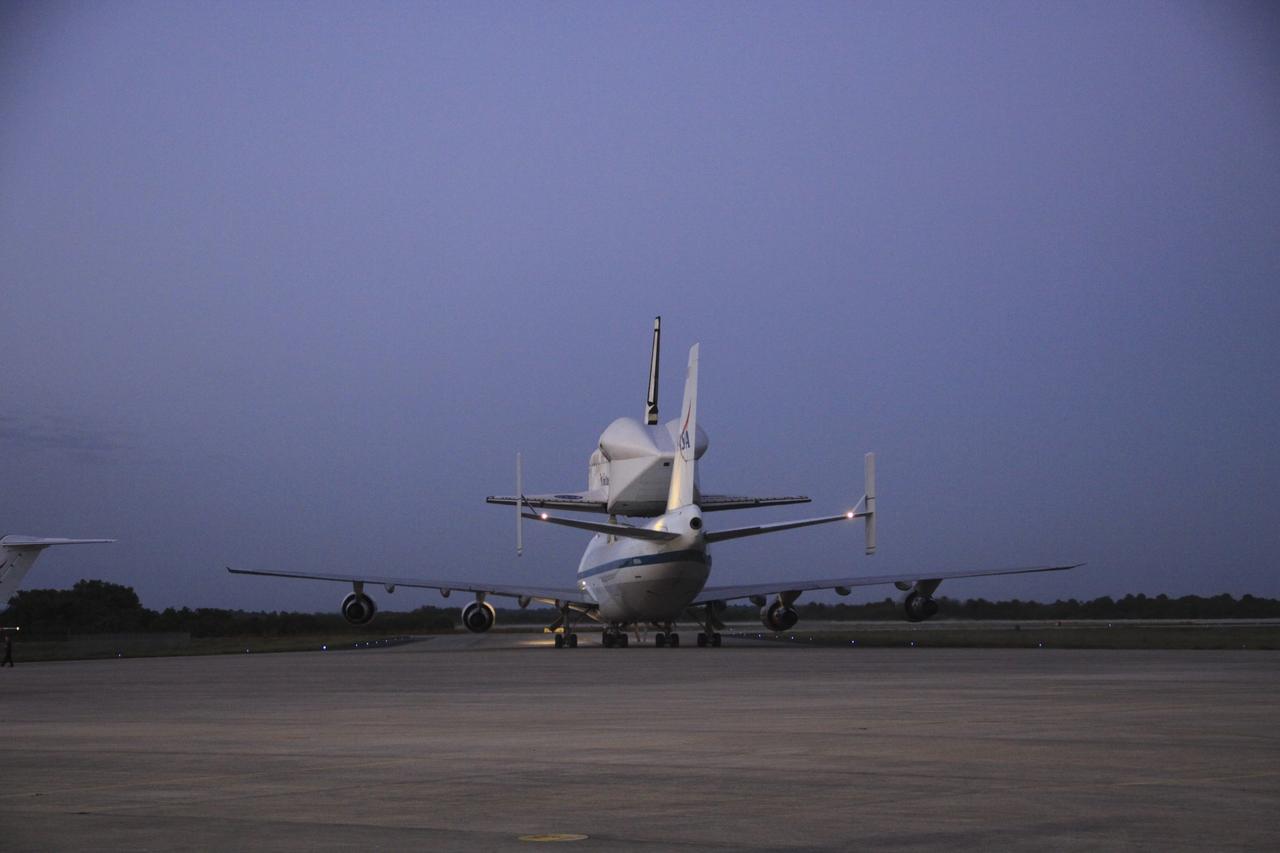CAPE CANAVERAL, Fla. – The Shuttle Carrier Aircraft transporting space shuttle Discovery to its new home taxis to the runway at the Shuttle Landing Facility at NASA’s Kennedy Space Center in Florida preparing to take off at about 7 a.m. EDT. The aircraft, known as an SCA, is a Boeing 747 jet, originally manufactured for commercial use, which was modified by NASA to transport the shuttles between destinations on Earth. This SCA, designated NASA 905, is assigned to the remaining ferry missions, delivering the shuttles to their permanent public display sites. NASA 905 is scheduled to ferry Discovery to the Washington Dulles International Airport in Virginia on April 17, after which the shuttle will be placed on display in the Smithsonian's National Air and Space Museum Steven F. Udvar-Hazy Center. For more information on the SCA, visit http://www.nasa.gov/centers/dryden/news/FactSheets/FS-013-DFRC.html. For more information on shuttle transition and retirement activities, visit http://www.nasa.gov/transition. Photo credit: NASA/Jim Grossmann