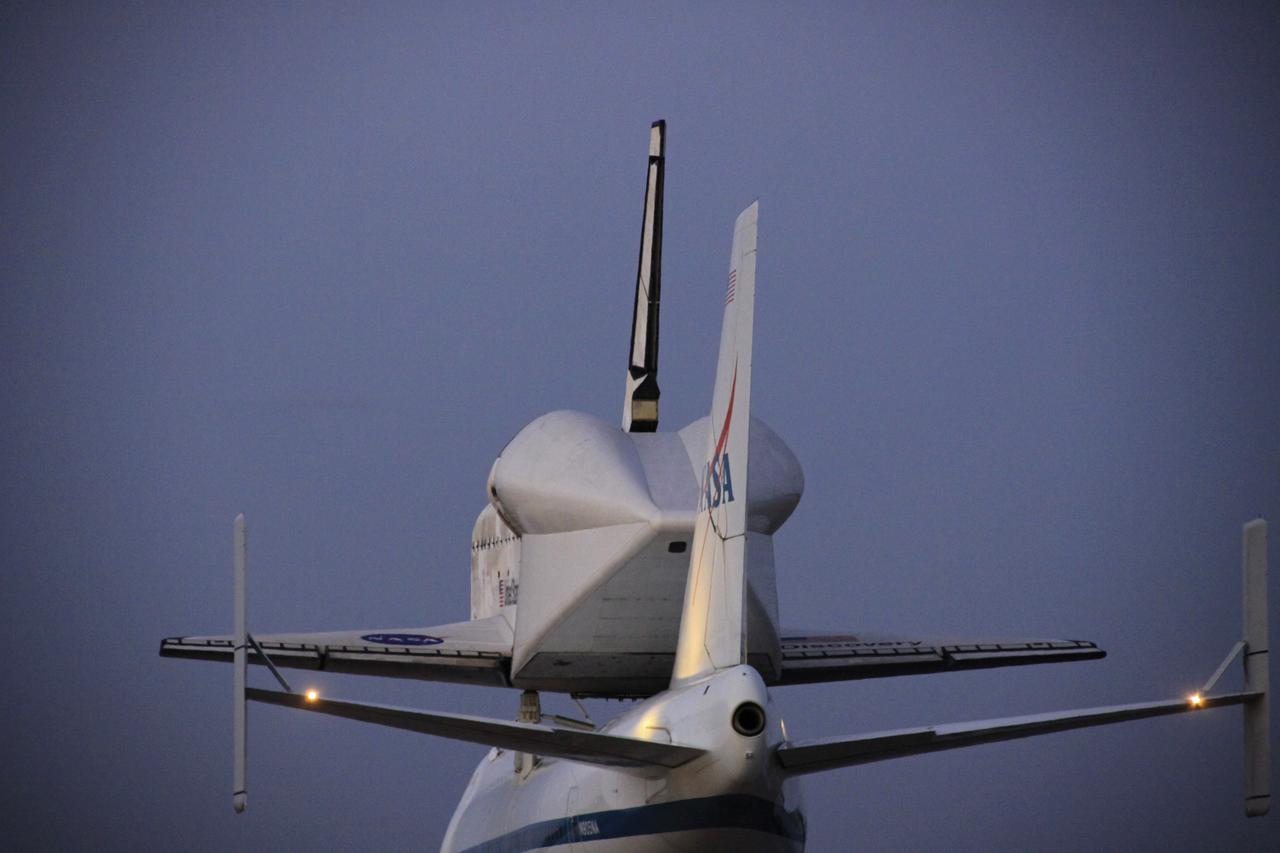 CAPE CANAVERAL, Fla. – The Shuttle Carrier Aircraft transporting space shuttle Discovery to its new home takes to the skies over the Shuttle Landing Facility at NASA’s Kennedy Space Center in Florida, lifting off at 7 a.m. EDT. The aircraft, known as an SCA, is a Boeing 747 jet, originally manufactured for commercial use, which was modified by NASA to transport the shuttles between destinations on Earth. This SCA, designated NASA 905, is assigned to the remaining ferry missions, delivering the shuttles to their permanent public display sites. NASA 905 is scheduled to ferry Discovery to the Washington Dulles International Airport in Virginia on April 17, after which the shuttle will be placed on display in the Smithsonian's National Air and Space Museum Steven F. Udvar-Hazy Center. For more information on the SCA, visit http://www.nasa.gov/centers/dryden/news/FactSheets/FS-013-DFRC.html. For more information on shuttle transition and retirement activities, visit http://www.nasa.gov/transition. Photo credit: NASA/Jim Grossmann