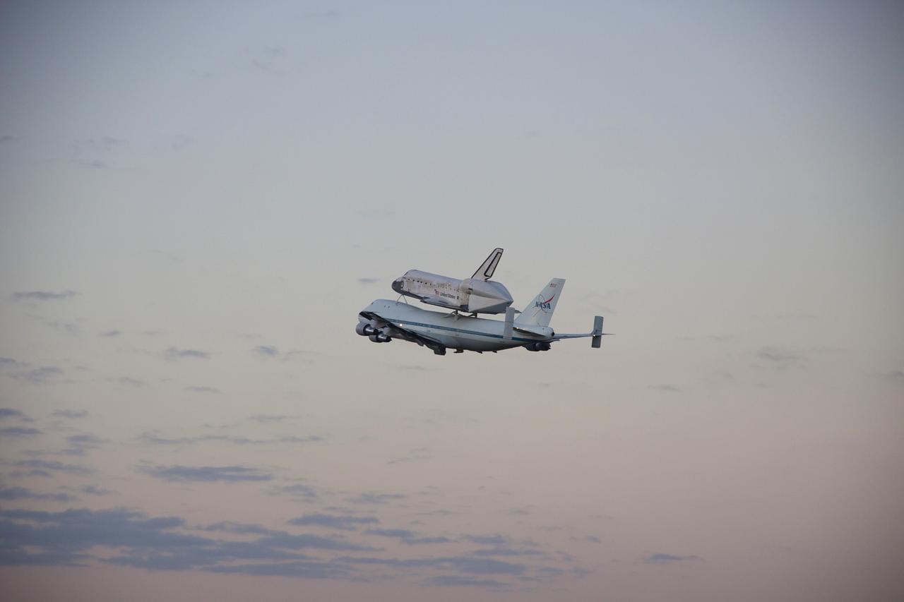 CAPE CANAVERAL, Fla. – The Shuttle Carrier Aircraft transporting space shuttle Discovery to its new home takes off from the Shuttle Landing Facility at NASA’s Kennedy Space Center in Florida at 7 a.m. EDT. The duo are heading south to fly over Brevard County’s beach communities for residents to get a look at the shuttle before it leaves the Space Coast for the last time. The aircraft, known as an SCA, is a Boeing 747 jet, originally manufactured for commercial use, which was modified by NASA to transport the shuttles between destinations on Earth. This SCA, designated NASA 905, is assigned to the remaining ferry missions, delivering the shuttles to their permanent public display sites. NASA 905 is scheduled to ferry Discovery to the Washington Dulles International Airport in Virginia on April 17, after which the shuttle will be placed on display in the Smithsonian's National Air and Space Museum Steven F. Udvar-Hazy Center. For more information on the SCA, visit http://www.nasa.gov/centers/dryden/news/FactSheets/FS-013-DFRC.html. For more information on shuttle transition and retirement activities, visit http://www.nasa.gov/transition. Photo credit: NASA/Jim Grossmann