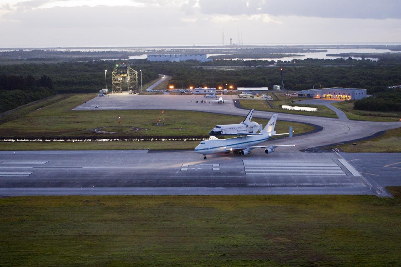 CAPE CANAVERAL, Fla. – At NASA Kennedy Space Center’s Shuttle Landing Facility in Florida, the Shuttle Carrier Aircraft, or SCA, with space shuttle Discovery secured atop, taxies out to the runway for a takeoff at 7 a.m. EDT. The aircraft, known as an SCA, is a Boeing 747 jet, originally manufactured for commercial use, which was modified by NASA to transport the shuttles between destinations on Earth. This SCA, designated NASA 905, is assigned to the remaining ferry missions, delivering the shuttles to their permanent public display sites. NASA 905 is scheduled to ferry Discovery to the Washington Dulles International Airport in Virginia on April 17, after which the shuttle will be placed on display in the Smithsonian’s National Air and Space Museum, Steven F. Udvar-Hazy Center in Chantilly, Va. For more information on the SCA, visit http://www.nasa.gov/centers/dryden/news/FactSheets/FS-013-DFRC.html. For more information on shuttle transition and retirement activities, visit http://www.nasa.gov/transition. Photo credit: NASA/Glenn Benson