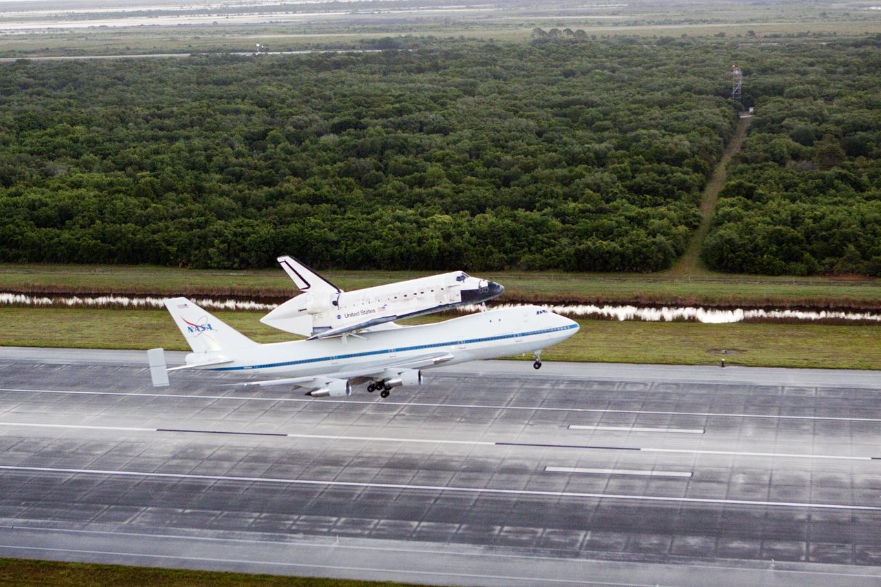 CAPE CANAVERAL, Fla. – In the early morning hours at NASA Kennedy Space Center’s Shuttle Landing Facility in Florida, the Shuttle Carrier Aircraft, or SCA, with space shuttle Discovery secured atop, takes off from runway 15 at 7 a.m. EDT. The SCA will deliver Discovery to its new home. The aircraft, known as an SCA, is a Boeing 747 jet, originally manufactured for commercial use, which was modified by NASA to transport the shuttles between destinations on Earth. This SCA, designated NASA 905, is assigned to the remaining ferry missions, delivering the shuttles to their permanent public display sites. NASA 905 is scheduled to ferry Discovery to the Washington Dulles International Airport in Virginia on April 17, after which the shuttle will be placed on display in the Smithsonian’s National Air and Space Museum, Steven F. Udvar-Hazy Center in Chantilly, Va. For more information on the SCA, visit http://www.nasa.gov/centers/dryden/news/FactSheets/FS-013-DFRC.html. For more information on shuttle transition and retirement activities, visit http://www.nasa.gov/transition. Photo credit: NASA/Glenn Benson