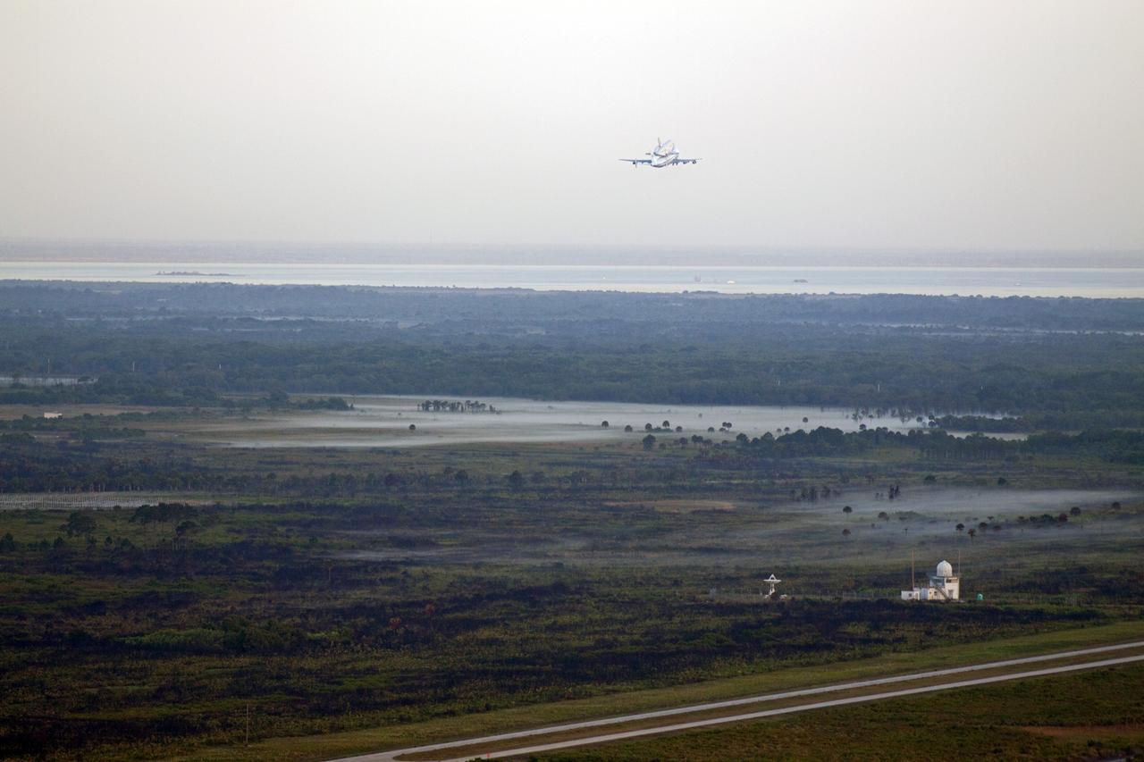 CAPE CANAVERAL, Fla. – The Shuttle Carrier Aircraft transporting space shuttle Discovery to its new home takes off from the Shuttle Landing Facility at NASA’s Kennedy Space Center in Florida at 7 a.m. EDT.    The aircraft, known as an SCA, is a Boeing 747 jet, originally manufactured for commercial use, which was modified by NASA to transport the shuttles between destinations on Earth. This SCA, designated NASA 905, is assigned to the remaining ferry missions, delivering the shuttles to their permanent public display sites.  NASA 905 is scheduled to ferry Discovery to the Washington Dulles International Airport in Virginia today, after which the shuttle will be placed on display in the Smithsonian's National Air and Space Museum Steven F. Udvar-Hazy Center. For more information on the SCA, visit http://www.nasa.gov/centers/dryden/news/FactSheets/FS-013-DFRC.html. For more information on shuttle transition and retirement activities, visit http://www.nasa.gov/transition. Photo credit: NASA/Glenn Benson