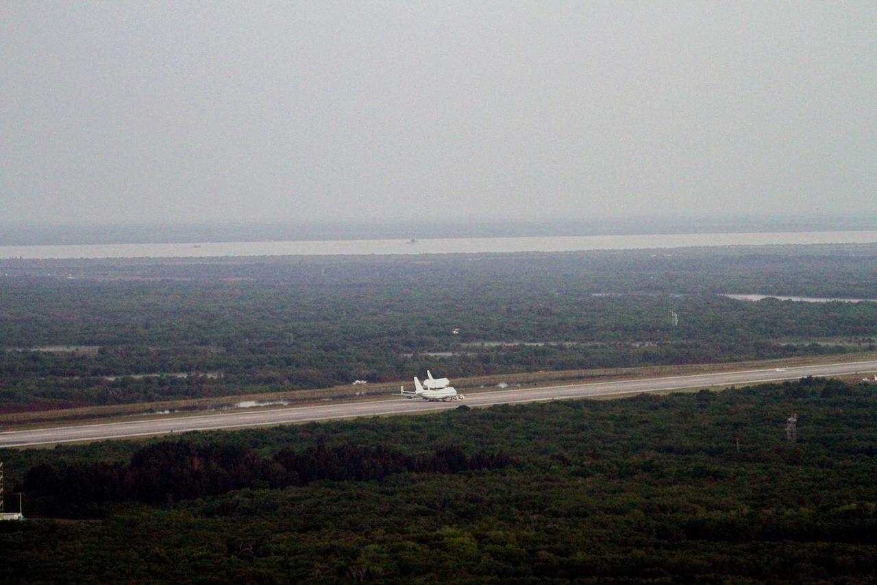 CAPE CANAVERAL, Fla. – The Shuttle Carrier Aircraft transporting space shuttle Discovery to its new home is ready for takeoff from the Shuttle Landing Facility at NASA’s Kennedy Space Center in Florida at about 7 a.m. EDT. The aircraft, known as an SCA, is a Boeing 747 jet, originally manufactured for commercial use, which was modified by NASA to transport the shuttles between destinations on Earth. This SCA, designated NASA 905, is assigned to the remaining ferry missions, delivering the shuttles to their permanent public display sites. NASA 905 is scheduled to ferry Discovery to the Washington Dulles International Airport in Virginia on April 17, after which the shuttle will be placed on display in the Smithsonian's National Air and Space Museum Steven F. Udvar-Hazy Center. For more information on the SCA, visit http://www.nasa.gov/centers/dryden/news/FactSheets/FS-013-DFRC.html. For more information on shuttle transition and retirement activities, visit http://www.nasa.gov/transition. Photo credit: NASA/Lorne Mathre