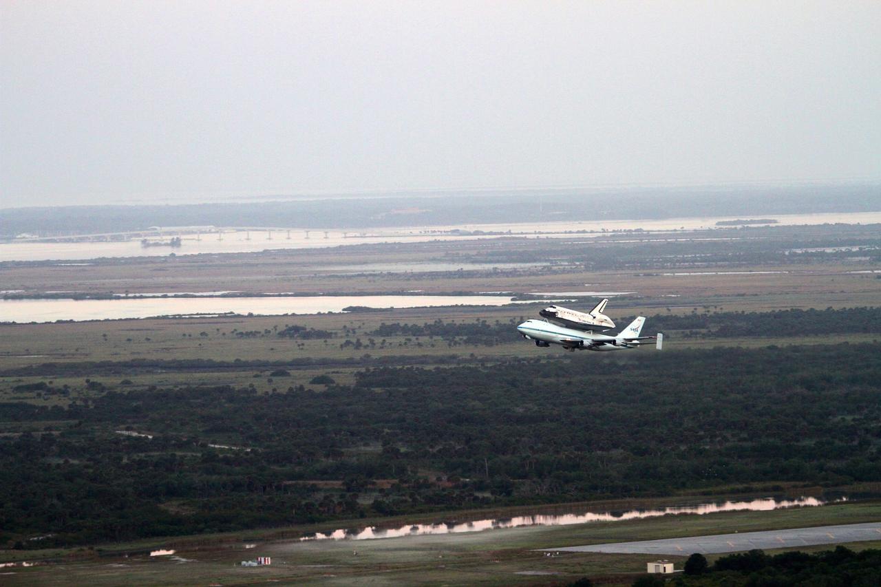 CAPE CANAVERAL, Fla. – The Shuttle Carrier Aircraft transporting space shuttle Discovery to its new home takes to the skies from the Shuttle Landing Facility at NASA’s Kennedy Space Center in Florida, lifting off at 7 a.m. EDT. The aircraft, known as an SCA, is a Boeing 747 jet, originally manufactured for commercial use, which was modified by NASA to transport the shuttles between destinations on Earth. This SCA, designated NASA 905, is assigned to the remaining ferry missions, delivering the shuttles to their permanent public display sites. NASA 905 is scheduled to ferry Discovery to the Washington Dulles International Airport in Virginia on April 17, after which the shuttle will be placed on display in the Smithsonian's National Air and Space Museum Steven F. Udvar-Hazy Center. For more information on the SCA, visit http://www.nasa.gov/centers/dryden/news/FactSheets/FS-013-DFRC.html. For more information on shuttle transition and retirement activities, visit http://www.nasa.gov/transition. Photo credit: NASA/Lorne Mathre