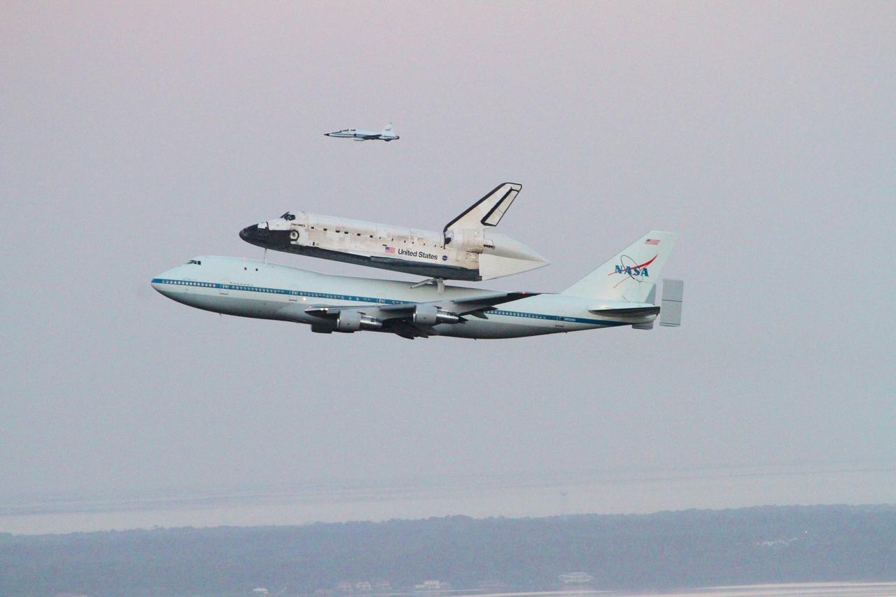 CAPE CANAVERAL, Fla. – The Shuttle Carrier Aircraft transporting space shuttle Discovery to its new home departs from NASA’s Kennedy Space Center in Florida at 7 a.m. EDT accompanied by a T-38 jet. The duo are heading south to fly over Brevard County’s beach communities for residents to get a look at the shuttle before it leaves the Space Coast for the last time. The aircraft, known as an SCA, is a Boeing 747 jet, originally manufactured for commercial use, which was modified by NASA to transport the shuttles between destinations on Earth. This SCA, designated NASA 905, is assigned to the remaining ferry missions, delivering the shuttles to their permanent public display sites. NASA 905 is scheduled to ferry Discovery to the Washington Dulles International Airport in Virginia on April 17, after which the shuttle will be placed on display in the Smithsonian's National Air and Space Museum Steven F. Udvar-Hazy Center. For more information on the SCA, visit http://www.nasa.gov/centers/dryden/news/FactSheets/FS-013-DFRC.html. For more information on shuttle transition and retirement activities, visit http://www.nasa.gov/transition. Photo credit: NASA/Lorne Mathre