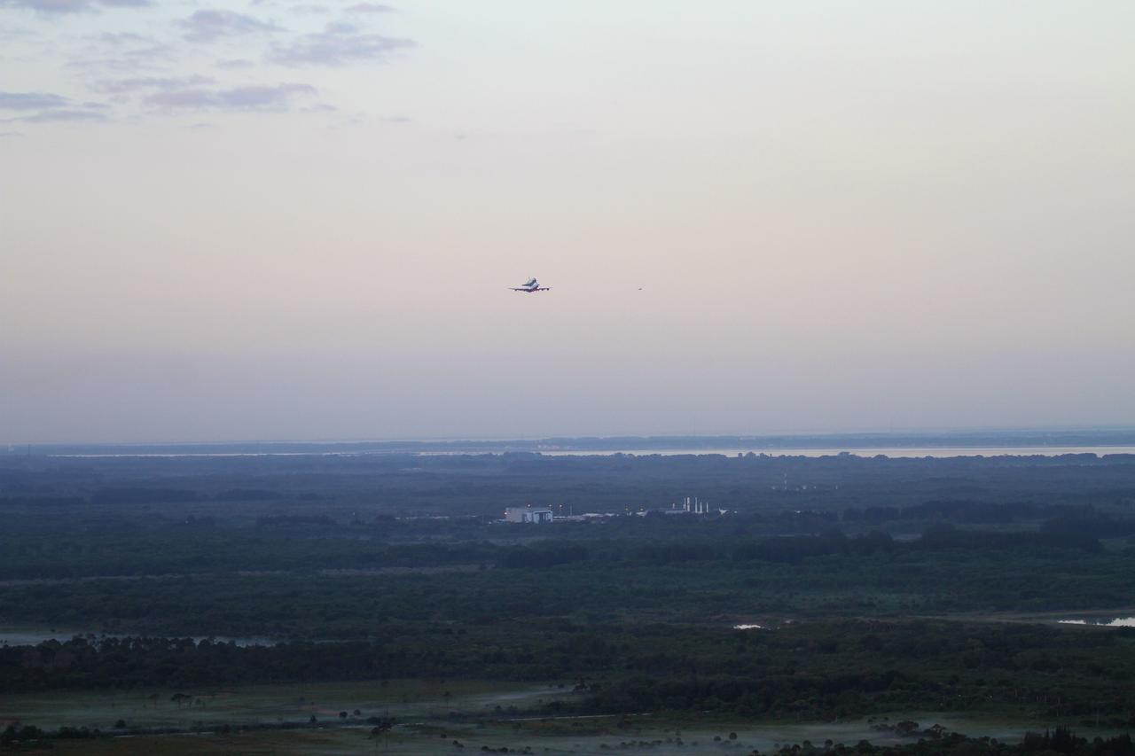 CAPE CANAVERAL, Fla. – The Shuttle Carrier Aircraft transporting space shuttle Discovery to its new home flies over the Kennedy Space Center Visitor Complex after taking off from Kennedy’s Shuttle Landing Facility at 7 a.m. EDT. The duo are heading south to fly over Brevard County’s beach communities, offering residents the opportunity to see the shuttle before it leaves the Space Coast for the last time. The aircraft, known as an SCA, is a Boeing 747 jet, originally manufactured for commercial use, which was modified by NASA to transport the shuttles between destinations on Earth. This SCA, designated NASA 905, is assigned to the remaining ferry missions, delivering the shuttles to their permanent public display sites. NASA 905 is scheduled to ferry Discovery to the Washington Dulles International Airport in Virginia on April 17, after which the shuttle will be placed on display in the Smithsonian's National Air and Space Museum Steven F. Udvar-Hazy Center. For more information on the SCA, visit http://www.nasa.gov/centers/dryden/news/FactSheets/FS-013-DFRC.html. For more information on shuttle transition and retirement activities, visit http://www.nasa.gov/transition. Photo credit: NASA/Lorne Mathre