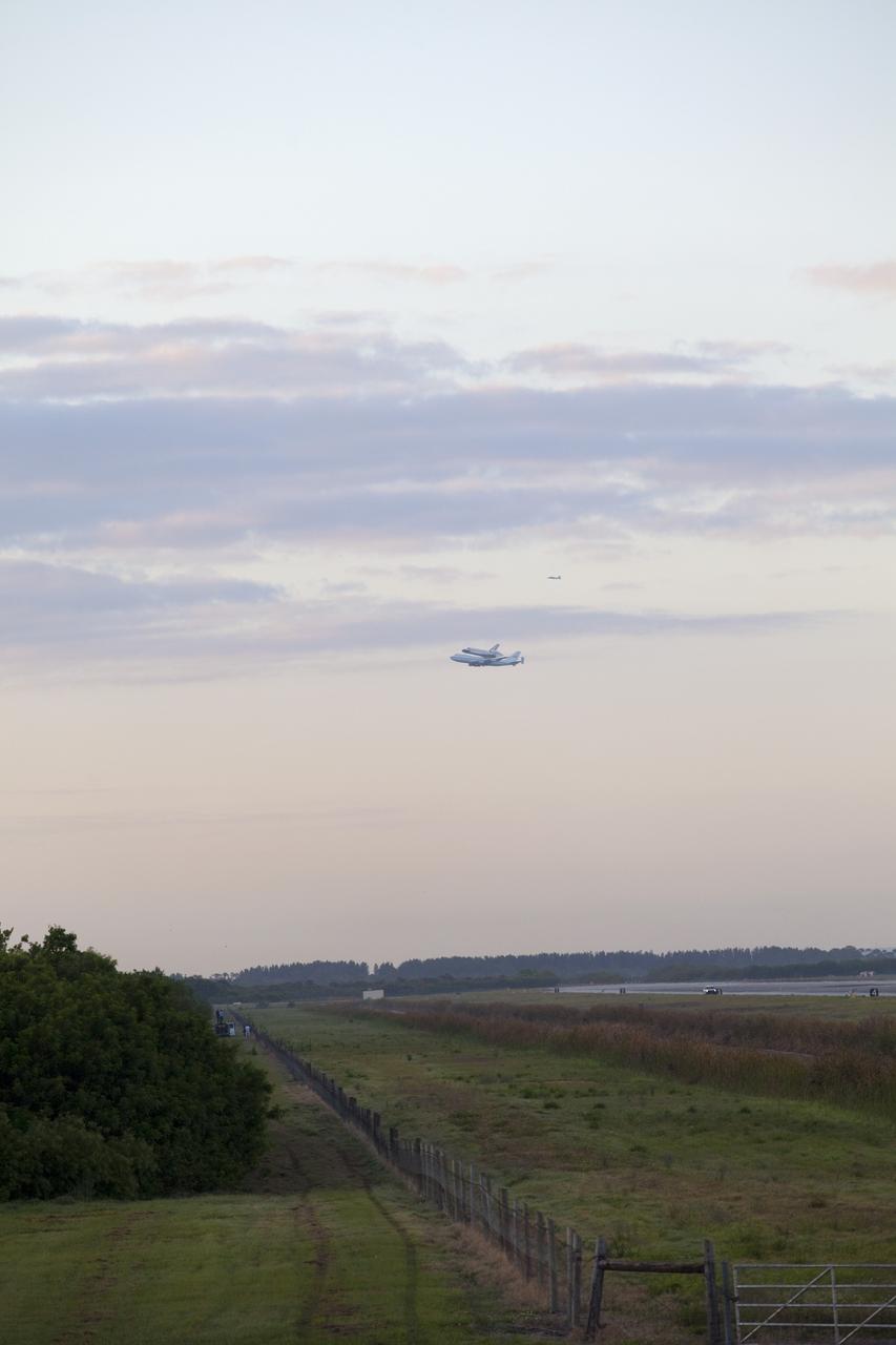 CAPE CANAVERAL, Fla. – Space shuttle Discovery, mounted to a Shuttle Carrier Aircraft, takes off from the Shuttle Landing Facility at NASA's Kennedy Space Center in Florida. The duo is beginning their 3 1/2 hour ferry flight to the Washington Dulles International Airport in Virginia. Also flying along with the pair is a T-38 training jet. Discovery is leaving Kennedy after more than 28 years of service beginning with its arrival on the space coast Nov. 9, 1983. Discovery first launched to space Aug. 30, 1984, on the STS-41D mission. Discovery is the agency's most-flown shuttle with 39 missions, more than 148 million miles and a total of one year in space. Discovery is set to move to the Smithsonian's National Air and Space Museum Steven F. Udvar-Hazy Center on April 19 where it will be placed on public display. For more information on the SCA, visit http://www.nasa.gov/centers/dryden/news/FactSheets/FS-013-DFRC.html. For more information on shuttle transition and retirement activities, visit http://www.nasa.gov/transition. Photo credit: NASA/Frankie Martin