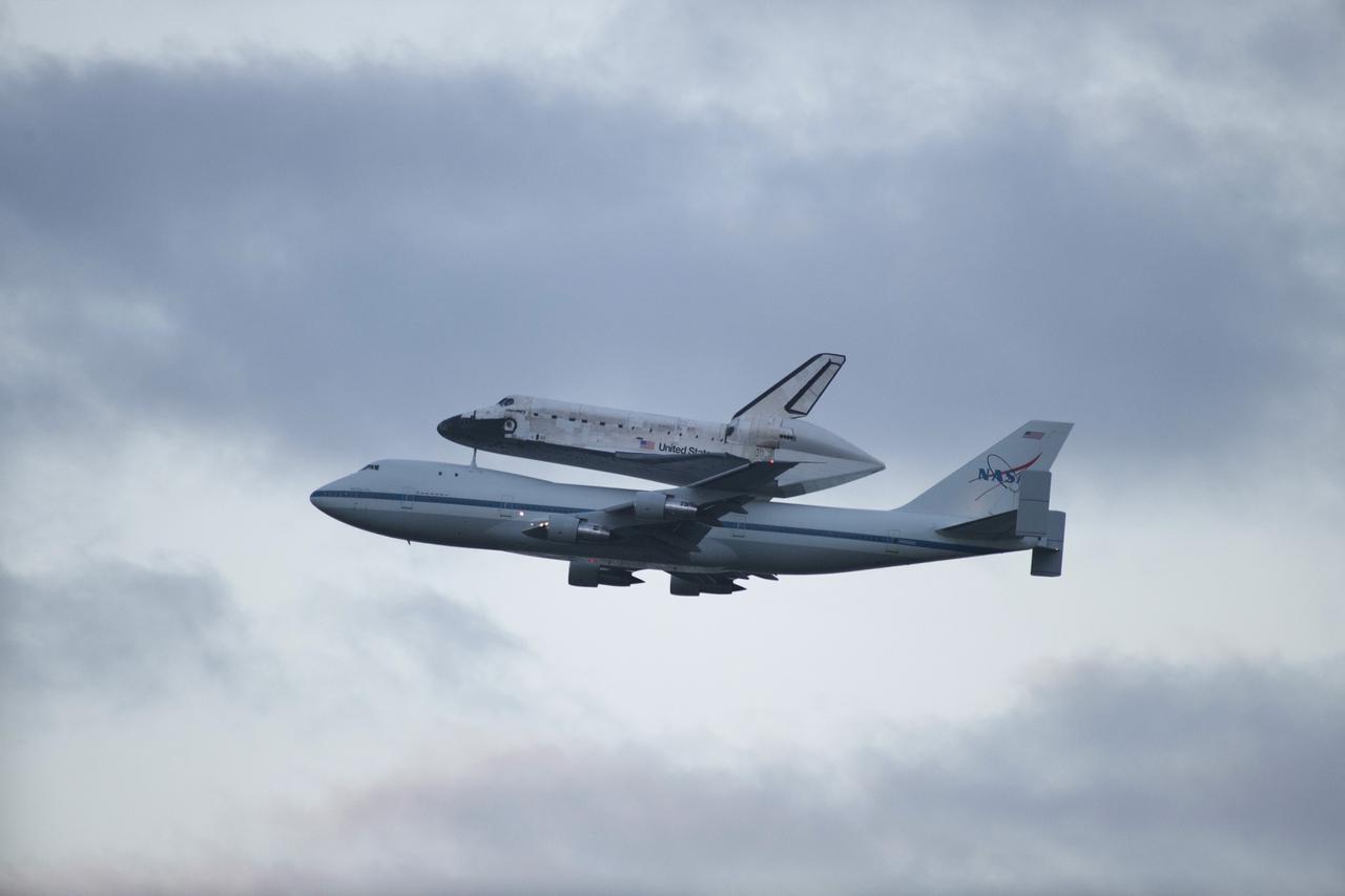 CAPE CANAVERAL, Fla. – Space shuttle Discovery, mounted to a Shuttle Carrier Aircraft, flies toward Cocoa Beach and Patrick Air Force Base after taking off from the Shuttle Landing Facility at NASA's Kennedy Space Center in Florida. The duo is beginning its ferry flight to the Washington Dulles International Airport in Virginia that also includes a flyby of the Space Coast and Washington, D.C. Discovery is leaving Kennedy after more than 28 years of service beginning with its arrival on the space coast Nov. 9, 1983. Discovery first launched to space Aug. 30, 1984, on the STS-41D mission. Discovery is the agency's most-flown shuttle with 39 missions, more than 148 million miles and a total of one year in space.         Discovery is set to move to the Smithsonian's National Air and Space Museum Steven F. Udvar-Hazy Center on April 19 where it will be placed on public display. For more information on the SCA, visit http://www.nasa.gov/centers/dryden/news/FactSheets/FS-013-DFRC.html. For more information on shuttle transition and retirement activities, visit http://www.nasa.gov/transition. Photo credit: NASA/Kenny Allen