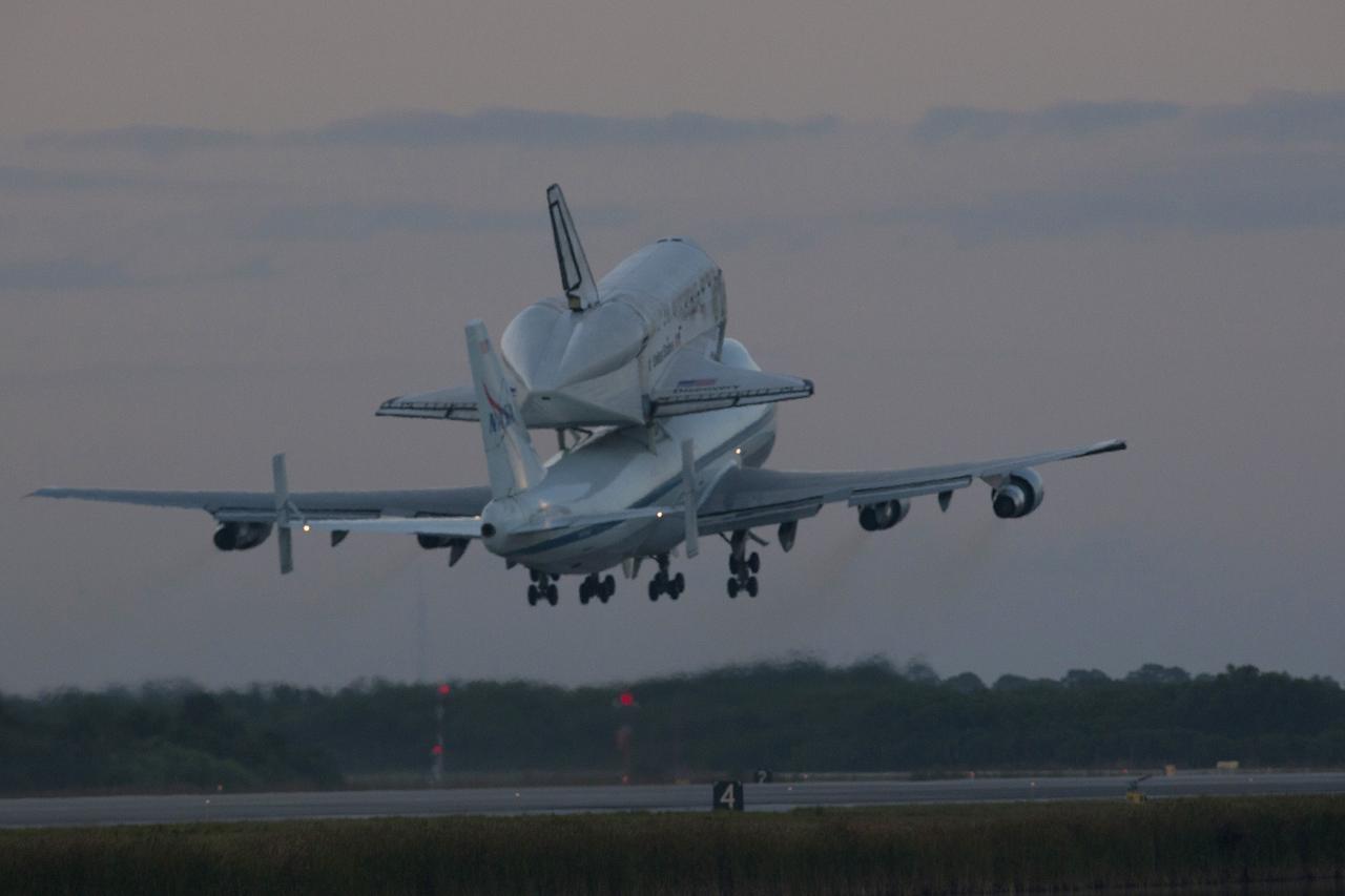 CAPE CANAVERAL, Fla. – The Shuttle Carrier Aircraft transporting space shuttle Discovery to its new home takes off from the Shuttle Landing Facility at NASA’s Kennedy Space Center in Florida at 7 a.m. EDT. The duo will fly south over Brevard County’s beach communities for residents to get a look at the shuttle before it leaves the Space Coast for the last time. The aircraft, known as an SCA, is a Boeing 747 jet, originally manufactured for commercial use, which was modified by NASA to transport the shuttles between destinations on Earth. This SCA, designated NASA 905, is assigned to the remaining ferry missions, delivering the shuttles to their permanent public display sites. NASA 905 is scheduled to ferry Discovery to the Washington Dulles International Airport in Virginia on April 17, after which the shuttle will be placed on display in the Smithsonian's National Air and Space Museum Steven F. Udvar-Hazy Center. For more information on the SCA, visit http://www.nasa.gov/centers/dryden/news/FactSheets/FS-013-DFRC.html. For more information on shuttle transition and retirement activities, visit http://www.nasa.gov/transition. Photo credit: NASA/Tim Powers and Rick Wetherington