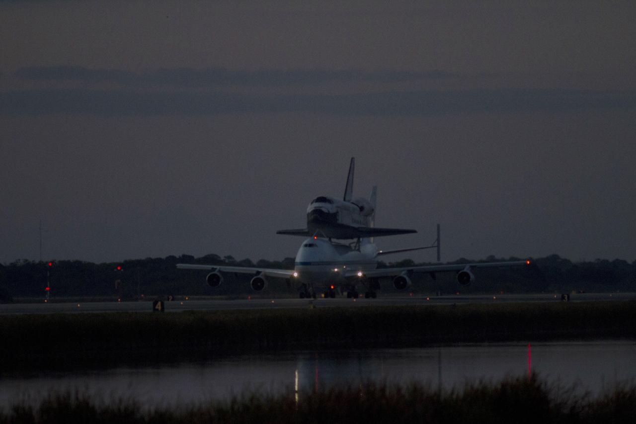 CAPE CANAVERAL, Fla. – At NASA Kennedy Space Center’s Shuttle Landing Facility in Florida, the Shuttle Carrier Aircraft, or SCA, with space shuttle Discovery secured atop, taxies past the midpoint on its way for a takeoff on runway 15 at 7 a.m. EDT. The aircraft, known as an SCA, is a Boeing 747 jet, originally manufactured for commercial use, which was modified by NASA to transport the shuttles between destinations on Earth. This SCA, designated NASA 905, is assigned to the remaining ferry missions, delivering the shuttles to their permanent public display sites. NASA 905 is scheduled to ferry Discovery to the Washington Dulles International Airport in Virginia on April 17, after which the shuttle will be placed on display in the Smithsonian’s National Air and Space Museum, Steven F. Udvar-Hazy Center in Chantilly, Va. For more information on the SCA, visit http://www.nasa.gov/centers/dryden/news/FactSheets/FS-013-DFRC.html. For more information on shuttle transition and retirement activities, visit http://www.nasa.gov/transition. Photo credit: NASA/Tim Powers and Rick Wetherington