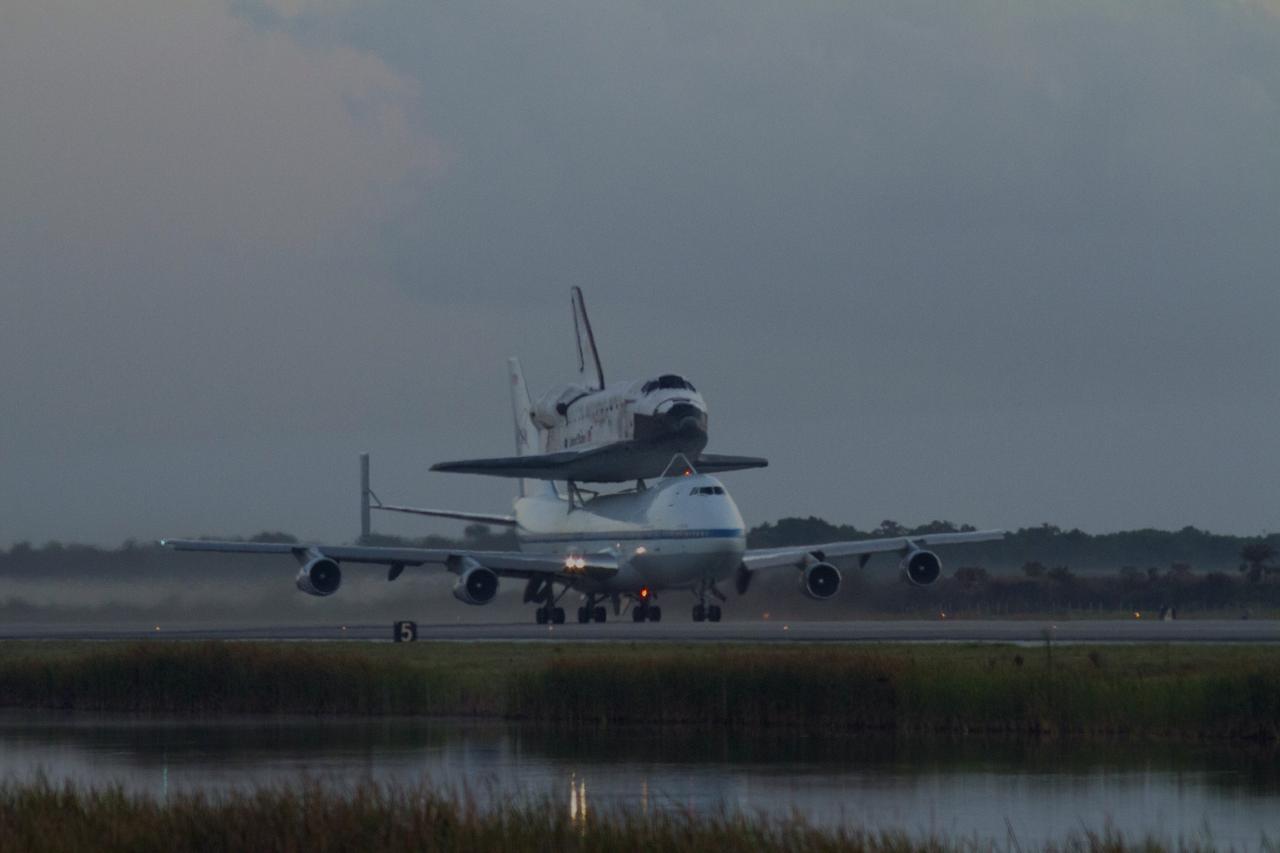 CAPE CANAVERAL, Fla. – In the early morning hours at NASA Kennedy Space Center’s Shuttle Landing Facility in Florida, the Shuttle Carrier Aircraft, or SCA, with space shuttle Discovery secured atop, begins takeoff on runway 15 at 7 a.m. EDT. The aircraft, known as an SCA, is a Boeing 747 jet, originally manufactured for commercial use, which was modified by NASA to transport the shuttles between destinations on Earth. This SCA, designated NASA 905, is assigned to the remaining ferry missions, delivering the shuttles to their permanent public display sites. NASA 905 is scheduled to ferry Discovery to the Washington Dulles International Airport in Virginia on April 17, after which the shuttle will be placed on display in the Smithsonian’s National Air and Space Museum, Steven F. Udvar-Hazy Center in Chantilly, Va. For more information on the SCA, visit http://www.nasa.gov/centers/dryden/news/FactSheets/FS-013-DFRC.html. For more information on shuttle transition and retirement activities, visit http://www.nasa.gov/transition. Photo credit: NASA/Tim Powers and Rick Wetherington