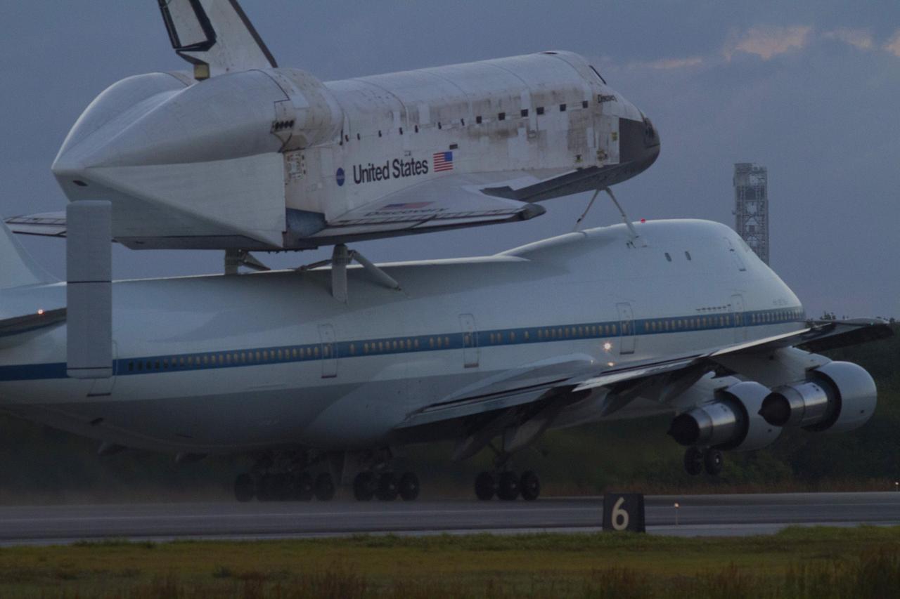 CAPE CANAVERAL, Fla. – In the early morning hours at NASA Kennedy Space Center’s Shuttle Landing Facility in Florida, the Shuttle Carrier Aircraft, or SCA, with space shuttle Discovery secured atop, begins takeoff on runway 15 at 7 a.m. EDT. Discovery is on the way to its new home. The aircraft, known as an SCA, is a Boeing 747 jet, originally manufactured for commercial use, which was modified by NASA to transport the shuttles between destinations on Earth. This SCA, designated NASA 905, is assigned to the remaining ferry missions, delivering the shuttles to their permanent public display sites. NASA 905 is scheduled to ferry Discovery to the Washington Dulles International Airport in Virginia on April 17, after which the shuttle will be placed on display in the Smithsonian’s National Air and Space Museum, Steven F. Udvar-Hazy Center in Chantilly, Va. For more information on the SCA, visit http://www.nasa.gov/centers/dryden/news/FactSheets/FS-013-DFRC.html. For more information on shuttle transition and retirement activities, visit http://www.nasa.gov/transition. Photo credit: NASA/Tim Powers and Rick Wetherington