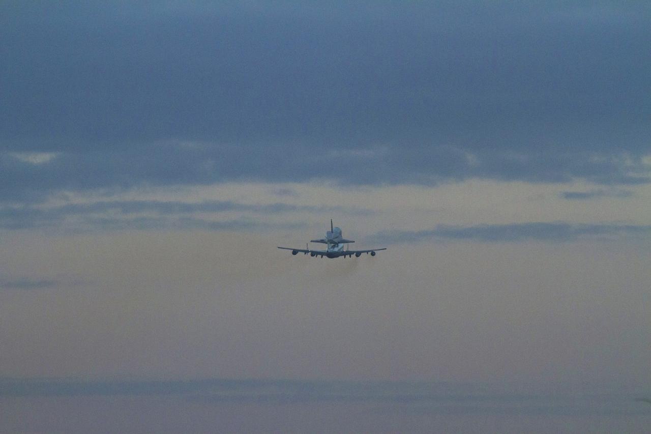 CAPE CANAVERAL, Fla. – In the early morning hours at NASA Kennedy Space Center’s Shuttle Landing Facility in Florida, the Shuttle Carrier Aircraft, or SCA, with space shuttle Discovery secured atop, is in the air after taking off from runway 15 at 7 a.m. EDT. The aircraft, known as an SCA, is a Boeing 747 jet, originally manufactured for commercial use, which was modified by NASA to transport the shuttles between destinations on Earth. This SCA, designated NASA 905, is assigned to the remaining ferry missions, delivering the shuttles to their permanent public display sites. NASA 905 is scheduled to ferry Discovery to the Washington Dulles International Airport in Virginia on April 17, after which the shuttle will be placed on display in the Smithsonian’s National Air and Space Museum, Steven F. Udvar-Hazy Center in Chantilly, Va. For more information on the SCA, visit http://www.nasa.gov/centers/dryden/news/FactSheets/FS-013-DFRC.html. For more information on shuttle transition and retirement activities, visit http://www.nasa.gov/transition. Photo credit: NASA/Tim Powers and Rick Wetherington
