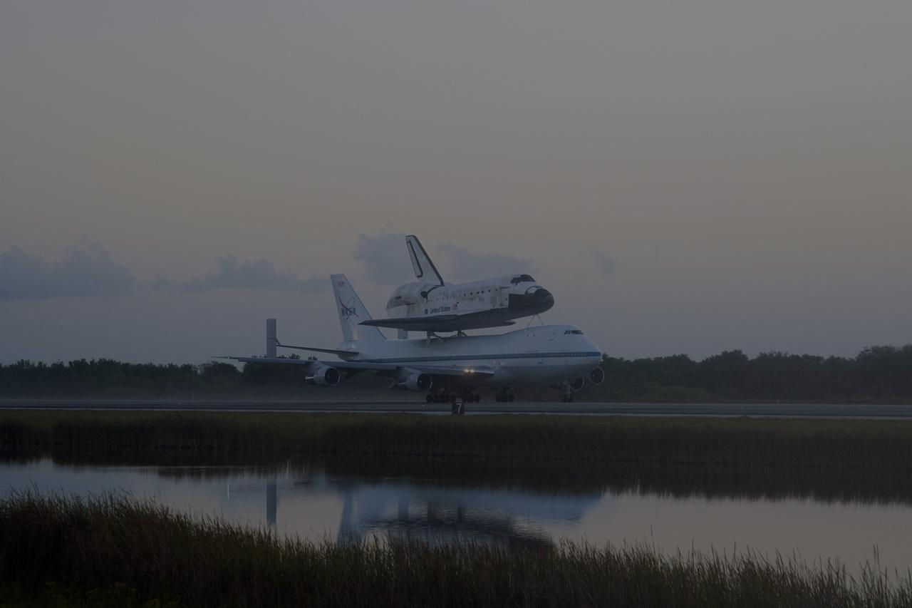 CAPE CANAVERAL, Fla. – In the early morning hours at NASA Kennedy Space Center’s Shuttle Landing Facility in Florida, the Shuttle Carrier Aircraft, or SCA, with space shuttle Discovery secured atop, taxies past the midpoint on its way for a takeoff on runway 15 at 7 a.m. EDT. The aircraft, known as an SCA, is a Boeing 747 jet, originally manufactured for commercial use, which was modified by NASA to transport the shuttles between destinations on Earth. This SCA, designated NASA 905, is assigned to the remaining ferry missions, delivering the shuttles to their permanent public display sites. NASA 905 is scheduled to ferry Discovery to the Washington Dulles International Airport in Virginia on April 17, after which the shuttle will be placed on display in the Smithsonian’s National Air and Space Museum, Steven F. Udvar-Hazy Center in Chantilly, Va. For more information on the SCA, visit http://www.nasa.gov/centers/dryden/news/FactSheets/FS-013-DFRC.html. For more information on shuttle transition and retirement activities, visit http://www.nasa.gov/transition. Photo credit: NASA/Tim Powers and Rick Wetherington