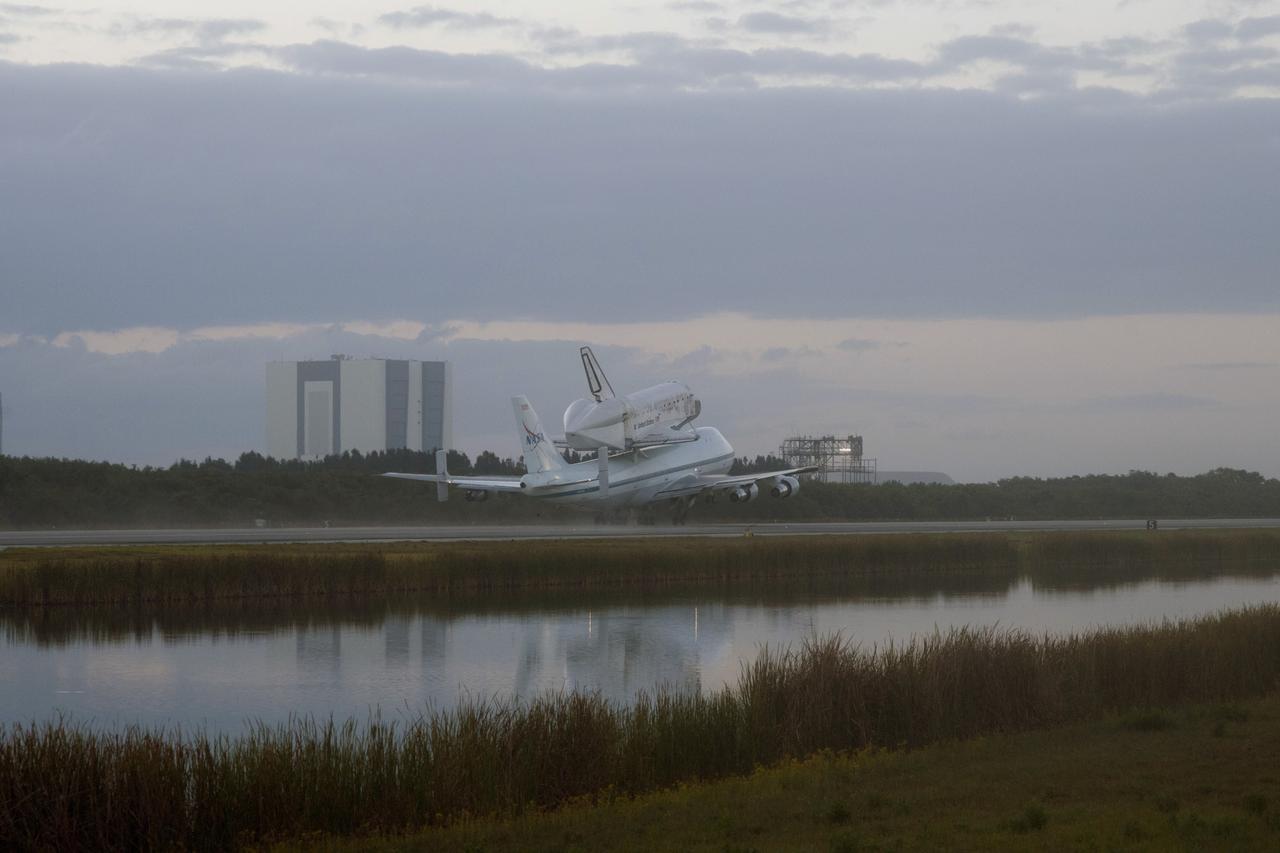 CAPE CANAVERAL, Fla. – In the early morning hours at NASA Kennedy Space Center’s Shuttle Landing Facility in Florida, the Shuttle Carrier Aircraft, or SCA, with space shuttle Discovery secured atop, taxies past the midpoint on its way for a takeoff on runway 15 at 7 a.m. EDT. The aircraft, known as an SCA, is a Boeing 747 jet, originally manufactured for commercial use, which was modified by NASA to transport the shuttles between destinations on Earth. This SCA, designated NASA 905, is assigned to the remaining ferry missions, delivering the shuttles to their permanent public display sites. NASA 905 is scheduled to ferry Discovery to the Washington Dulles International Airport in Virginia on April 17, after which the shuttle will be placed on display in the Smithsonian’s National Air and Space Museum, Steven F. Udvar-Hazy Center in Chantilly, Va. For more information on the SCA, visit http://www.nasa.gov/centers/dryden/news/FactSheets/FS-013-DFRC.html. For more information on shuttle transition and retirement activities, visit http://www.nasa.gov/transition. Photo credit: NASA/Tim Powers and Rick Wetherington