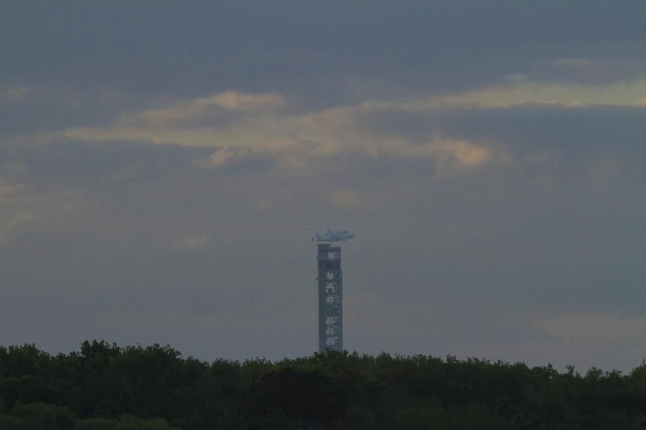 CAPE CANAVERAL, Fla. – Space shuttle Discovery, mounted to a Shuttle Carrier Aircraft, or SCA, takes off from NASA Kennedy Space Center’s Shuttle Landing Facility runway 15 in Florida at 7 a.m. EDT. The duo is beginning its ferry flight to the Washington Dulles International Airport in Virginia that also includes a flyby of the Space Coast and Washington, D.C. Also flying along with the pair is a T-38 training jet. Discovery is leaving Kennedy after more than 28 years of service beginning with its arrival on the space coast Nov. 9, 1983. Discovery first launched to space Aug. 30, 1984, on the STS-41D mission. Discovery is the agency’s most-flown shuttle with 39 missions, more than 148 million miles and a total of one year in space. Discovery is set to move to the Smithsonian’s National Air and Space Museum, Steven F. Udvar-Hazy Center in Chantilly, Va., on April 19 where it will be place on public display. For more information on the SCA, visit http://www.nasa.gov/centers/dryden/news/FactSheets/FS-013-DFRC.html. For more information on shuttle transition and retirement activities, visit http://www.nasa.gov/transition. Photo credit: NASA/Tim Powers and Rick Wetherington
