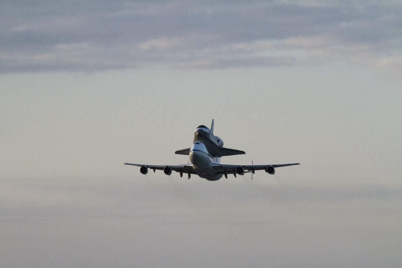 CAPE CANAVERAL, Fla. – Space shuttle Discovery, mounted to a Shuttle Carrier Aircraft, or SCA, takes off from NASA Kennedy Space Center’s Shuttle Landing Facility runway 15 in Florida at 7 a.m. EDT. The duo is beginning its ferry flight to the Washington Dulles International Airport in Virginia that also includes a flyby of the Space Coast and Washington, D.C. Discovery is leaving Kennedy after more than 28 years of service beginning with its arrival on the space coast Nov. 9, 1983. Discovery first launched to space Aug. 30, 1984, on the STS-41D mission. Discovery is the agency’s most-flown shuttle with 39 missions, more than 148 million miles and a total of one year in space. Discovery is set to move to the Smithsonian’s National Air and Space Museum, Steven F. Udvar-Hazy Center in Chantilly, Va., on April 19 where it will be place on public display. For more information on the SCA, visit http://www.nasa.gov/centers/dryden/news/FactSheets/FS-013-DFRC.html. For more information on shuttle transition and retirement activities, visit http://www.nasa.gov/transition. Photo credit: NASA/Tim Powers and Rick Wetherington