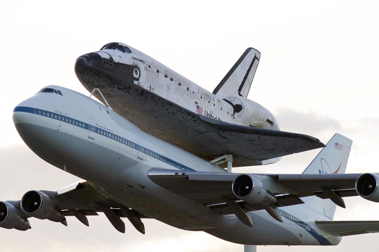 CAPE CANAVERAL, Fla. – A spectacular close up view of space shuttle Discovery, mounted to a Shuttle Carrier Aircraft, or SCA, after it takes off from NASA Kennedy Space Center’s Shuttle Landing Facility runway 15 in Florida at 7 a.m. EDT. The duo is beginning its ferry flight to the Washington Dulles International Airport in Virginia that also includes a flyby of the Space Coast and Washington, D.C. Discovery is leaving Kennedy after more than 28 years of service beginning with its arrival on the space coast Nov. 9, 1983. Discovery first launched to space Aug. 30, 1984, on the STS-41D mission. Discovery is the agency’s most-flown shuttle with 39 missions, more than 148 million miles and a total of one year in space. Discovery is set to move to the Smithsonian’s National Air and Space Museum, Steven F. Udvar-Hazy Center in Chantilly, Va., on April 19 where it will be place on public display. For more information on the SCA, visit http://www.nasa.gov/centers/dryden/news/FactSheets/FS-013-DFRC.html. For more information on shuttle transition and retirement activities, visit http://www.nasa.gov/transition. Photo credit: NASA/Tim Powers and Rick Wetherington