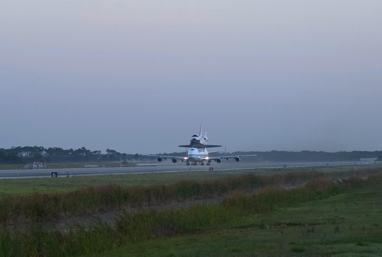 CAPE CANAVERAL, Fla. – Sunrise over the Shuttle Landing Facility at NASA’s Kennedy Space Center in Florida reveals the Shuttle Carrier Aircraft that is transporting space shuttle Discovery to its new home preparing for takeoff.    The aircraft, known as an SCA, is a Boeing 747 jet, originally manufactured for commercial use, which was modified by NASA to transport the shuttles between destinations on Earth. This SCA, designated NASA 905, is assigned to the remaining ferry missions, delivering the shuttles to their permanent public display sites.  NASA 905 is scheduled to ferry Discovery to the Washington Dulles International Airport in Virginia on April 17, after which the shuttle will be placed on display in the Smithsonian's National Air and Space Museum Steven F. Udvar-Hazy Center. For more information on the SCA, visit http://www.nasa.gov/centers/dryden/news/FactSheets/FS-013-DFRC.html. For more information on shuttle transition and retirement activities, visit http://www.nasa.gov/transition. Photo credit: NASA/Rusty Backer