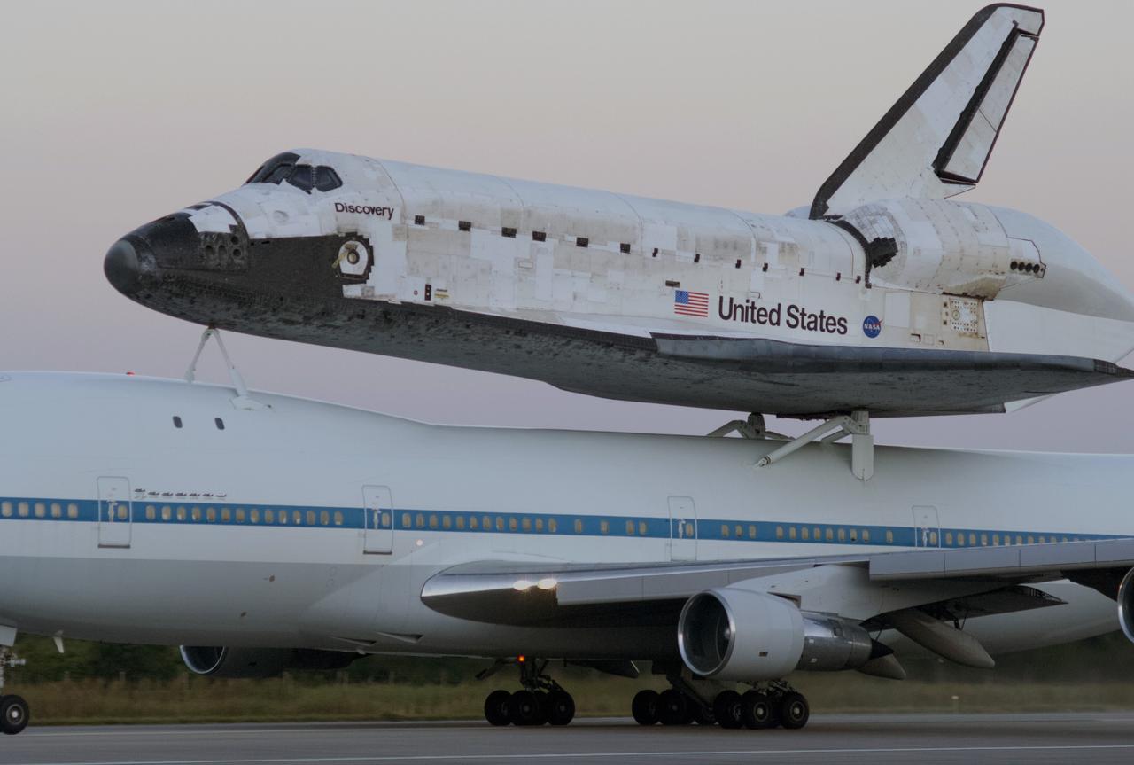 CAPE CANAVERAL, Fla. – Sunrise over the Shuttle Landing Facility at NASA’s Kennedy Space Center in Florida reveals the Shuttle Carrier Aircraft that is transporting space shuttle Discovery to its new home preparing for takeoff.    The aircraft, known as an SCA, is a Boeing 747 jet, originally manufactured for commercial use, which was modified by NASA to transport the shuttles between destinations on Earth. This SCA, designated NASA 905, is assigned to the remaining ferry missions, delivering the shuttles to their permanent public display sites.  NASA 905 is scheduled to ferry Discovery to the Washington Dulles International Airport in Virginia on April 17, after which the shuttle will be placed on display in the Smithsonian's National Air and Space Museum Steven F. Udvar-Hazy Center. For more information on the SCA, visit http://www.nasa.gov/centers/dryden/news/FactSheets/FS-013-DFRC.html. For more information on shuttle transition and retirement activities, visit http://www.nasa.gov/transition. Photo credit: NASA/Rusty Backer