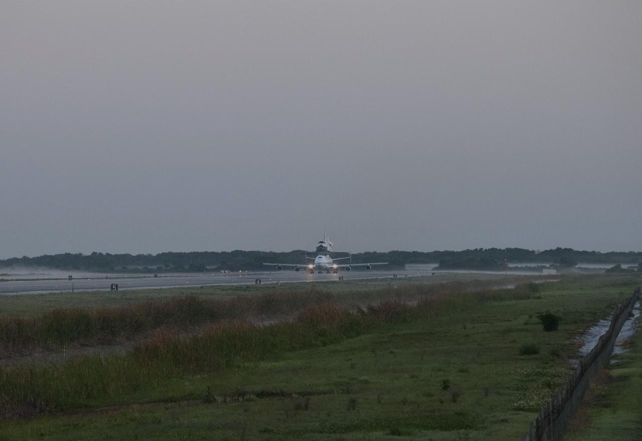 CAPE CANAVERAL, Fla. – As the sun rises over the Shuttle Landing Facility at NASA’s Kennedy Space Center in Florida, the Shuttle Carrier Aircraft transporting space shuttle Discovery to its new home taxis down the runway, ready for takeoff. The aircraft, known as an SCA, is a Boeing 747 jet, originally manufactured for commercial use, which was modified by NASA to transport the shuttles between destinations on Earth. This SCA, designated NASA 905, is assigned to the remaining ferry missions, delivering the shuttles to their permanent public display sites. NASA 905 is scheduled to ferry Discovery to the Washington Dulles International Airport in Virginia on April 17, after which the shuttle will be placed on display in the Smithsonian's National Air and Space Museum Steven F. Udvar-Hazy Center. For more information on the SCA, visit http://www.nasa.gov/centers/dryden/news/FactSheets/FS-013-DFRC.html. For more information on shuttle transition and retirement activities, visit http://www.nasa.gov/transition. Photo credit: NASA/Rusty Backer