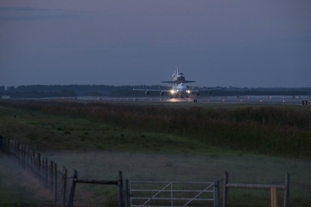 CAPE CANAVERAL, Fla. – Daybreak at the Shuttle Landing Facility at NASA’s Kennedy Space Center in Florida finds the Shuttle Carrier Aircraft that is transporting space shuttle Discovery to its new home taxiing down the runway, preparing for takeoff. The aircraft, known as an SCA, is a Boeing 747 jet, originally manufactured for commercial use, which was modified by NASA to transport the shuttles between destinations on Earth. This SCA, designated NASA 905, is assigned to the remaining ferry missions, delivering the shuttles to their permanent public display sites. NASA 905 is scheduled to ferry Discovery to the Washington Dulles International Airport in Virginia on April 17, after which the shuttle will be placed on display in the Smithsonian's National Air and Space Museum Steven F. Udvar-Hazy Center. For more information on the SCA, visit http://www.nasa.gov/centers/dryden/news/FactSheets/FS-013-DFRC.html. For more information on shuttle transition and retirement activities, visit http://www.nasa.gov/transition. Photo credit: NASA/Rusty Backer