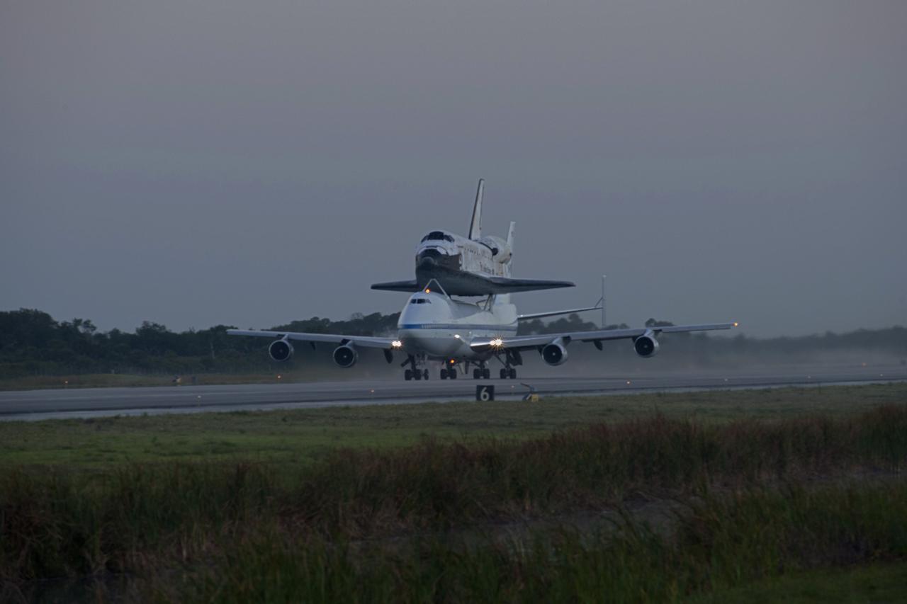 CAPE CANAVERAL, Fla. – Daybreak at the Shuttle Landing Facility at NASA’s Kennedy Space Center in Florida finds the Shuttle Carrier Aircraft that is transporting space shuttle Discovery to its new home taxiing down the runway, preparing for takeoff. The aircraft, known as an SCA, is a Boeing 747 jet, originally manufactured for commercial use, which was modified by NASA to transport the shuttles between destinations on Earth. This SCA, designated NASA 905, is assigned to the remaining ferry missions, delivering the shuttles to their permanent public display sites. NASA 905 is scheduled to ferry Discovery to the Washington Dulles International Airport in Virginia on April 17, after which the shuttle will be placed on display in the Smithsonian's National Air and Space Museum Steven F. Udvar-Hazy Center. For more information on the SCA, visit http://www.nasa.gov/centers/dryden/news/FactSheets/FS-013-DFRC.html. For more information on shuttle transition and retirement activities, visit http://www.nasa.gov/transition. Photo credit: NASA/Rusty Backer