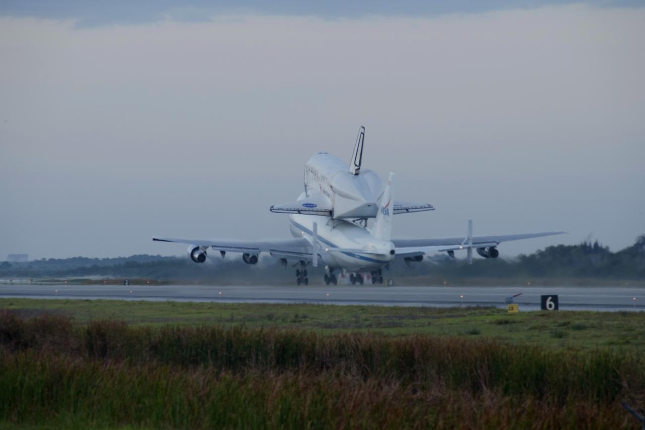 CAPE CANAVERAL, Fla. – At the Shuttle Landing Facility at NASA’s Kennedy Space Center in Florida, the Shuttle Carrier Aircraft transporting space shuttle Discovery to its new home lifts off the runway at 7 a.m. EDT just after daybreak. The aircraft, known as an SCA, is a Boeing 747 jet, originally manufactured for commercial use, which was modified by NASA to transport the shuttles between destinations on Earth. This SCA, designated NASA 905, is assigned to the remaining ferry missions, delivering the shuttles to their permanent public display sites. NASA 905 is scheduled to ferry Discovery to the Washington Dulles International Airport in Virginia on April 17, after which the shuttle will be placed on display in the Smithsonian's National Air and Space Museum Steven F. Udvar-Hazy Center. For more information on the SCA, visit http://www.nasa.gov/centers/dryden/news/FactSheets/FS-013-DFRC.html. For more information on shuttle transition and retirement activities, visit http://www.nasa.gov/transition. Photo credit: NASA/Rusty Backer