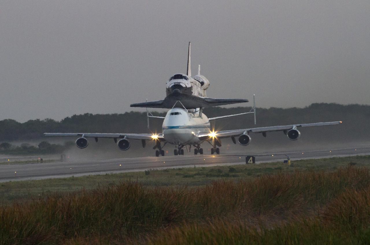 CAPE CANAVERAL, Fla. - With space shuttle Discovery secured to its back, the Shuttle Carrier Aircraft is positioned for takeoff at the north end of runway 15 at NASA's Kennedy Space Center in Florida. The duo departed Kennedy at 7 a.m. EDT. The aircraft, known as an SCA, is a Boeing 747 jet, originally manufactured for commercial use, which was modified by NASA to transport the shuttles between destinations on Earth. This SCA, designated NASA 905, is assigned to the remaining ferry missions, delivering the shuttles to their permanent public display sites. NASA 905 carried Discovery to the Washington Dulles International Airport in Virginia on April 17, after which the shuttle will be placed on display in the Smithsonian's National Air and Space Museum, Steven F. Udvar-Hazy Center in Chantilly, Va. For more information on the SCA, visit http://www.nasa.gov/centers/dryden/news/FactSheets/FS- 013-DFRC.html. For more information on shuttle transition and retirement activities, visit http://www .nasa.gov/transition. Photo credit: NASA/Rusty Backer