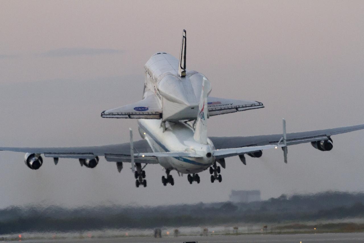 CAPE CANAVERAL, Fla. - The wheels of the Shuttle Carrier Aircraft leave the ground at NASA's Kennedy Space Center in Florida as space shuttle Discovery's ferry flight begins. The duo took off from Kennedy's runway 15 at 7 a.m. EDT. The aircraft, known as an SCA, is a Boeing 747 jet, originally manufactured for commercial use, which was modified by NASA to transport the shuttles between destinations on Earth. This SCA, designated NASA 905, is assigned to the remaining ferry missions, delivering the shuttles to their permanent public display sites. NASA 905 carried Discovery to the Washington Dulles International Airport in Virginia on April 17, after which the shuttle will be placed on display in the Smithsonian's National Air and Space Museum, Steven F. Udvar-Hazy Center in Chantilly, Va. For more information on the SCA, visit http://www.nasa.gov/centers/dryden/news/FactSheets/FS- 013-DFRC.html. For more information on shuttle transition and retirement activities, visit http://www .nasa.gov/transition. Photo credit: NASA/Rusty Backer