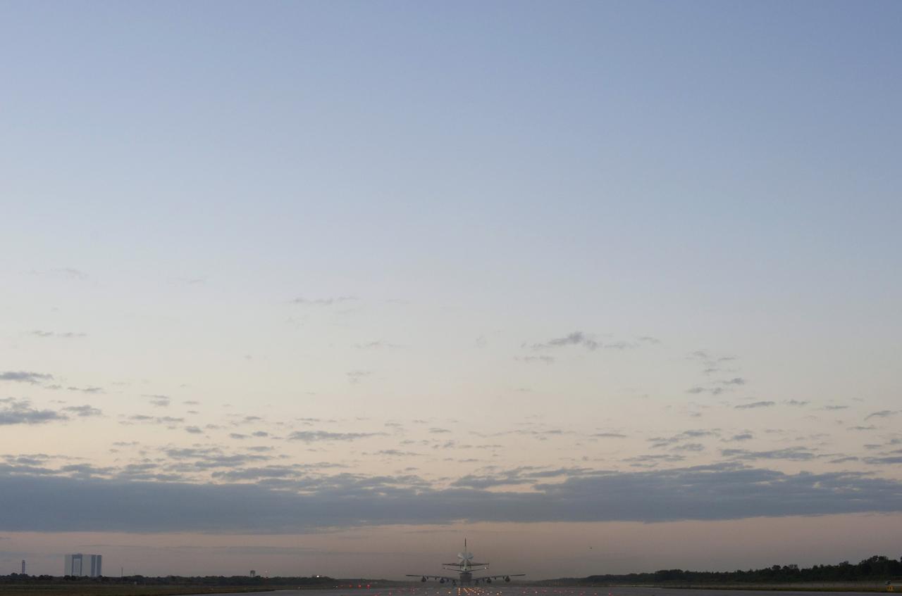 CAPE CANAVERAL, Fla. - Dawn breaks at NASA's Kennedy Space Center in Florida, revealing the Shuttle  Carrier Aircraft and its piggybacked cargo, space shuttle Discovery, rolling down runway 15 toward an on-time  takeoff at 7 a.m. EDT.    The duo is beginning its ferry flight to the Washington Dulles International Airport in Virginia that also includes a flyby of the Space Coast and Washington, D.C. Discovery is leaving Kennedy after more than 28 years of service beginning with its arrival on the space coast Nov. 9, 1983. Discovery is set to move to the Smithsonian's National Air and Space Museum, Steven F. Udvar-Hazy Center in Chantilly, Va., on April 19 where it will be placed on public display.  For more information on the Shuttle Carrier Aircraft, visit http://www.nasa .gov/centers/dryden/news/FactSheets/FS-013- DFRC.html. For more information on shuttle transition and retirement activities, visit http://www.nasa.gov/transition. Photo credit: NASA/Tim Powers and Tim Terry