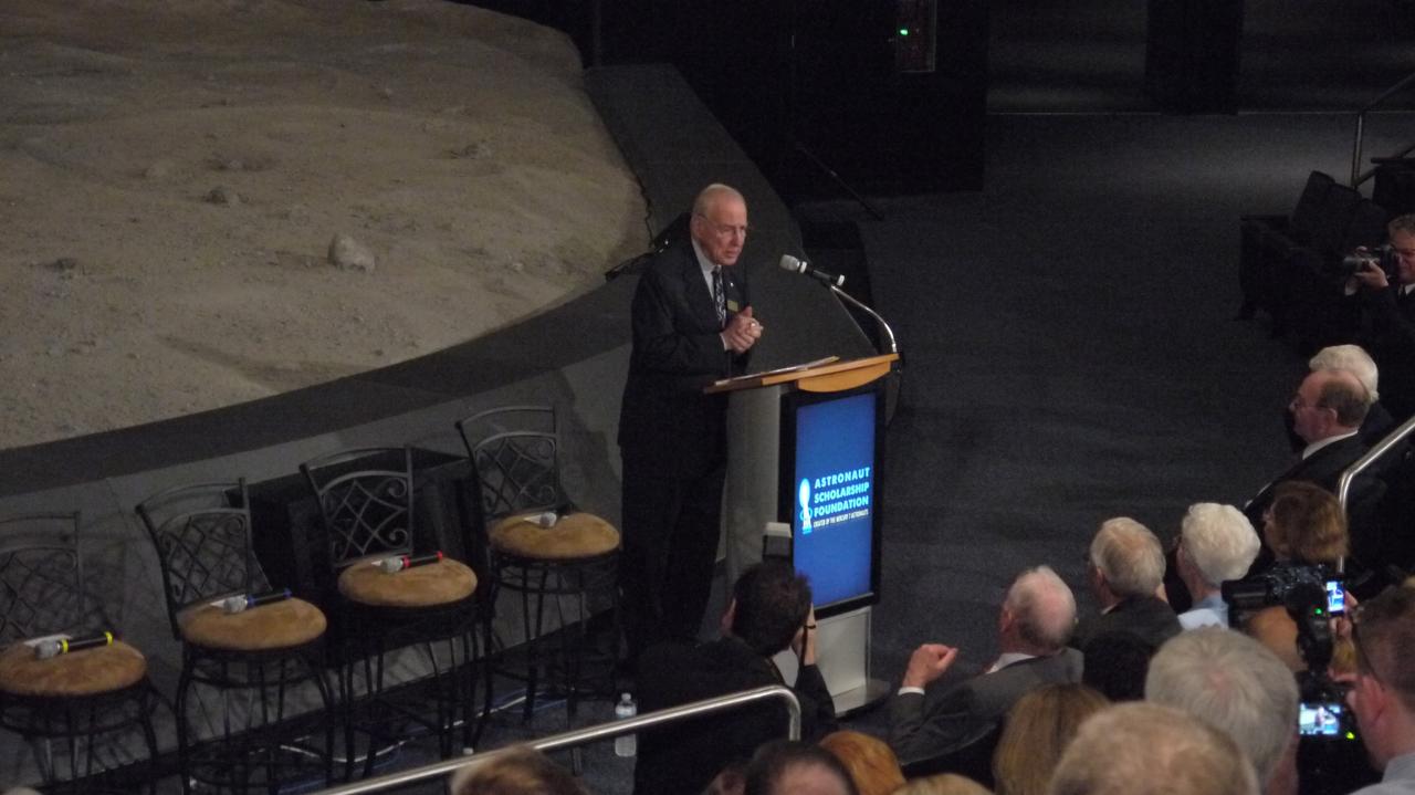 CAPE CANAVERAL, Fla. -- Apollo 8 Command Module Pilot and Apollo 13 Commander Jim Lovell addresses the audience at the 40th anniversary celebration of Apollo 16's lunar landing, which occurred April 20, 1972. The Astronaut Scholarship Foundation hosted the soiree at the Kennedy Space Center Visitor Complex's Saturn V Center. The 11-day Apollo 16 mission featured three moonwalks, including a nearly 17-mile lunar rover road trip to collect more than 200 pounds of moon rocks to return to Earth.          Photo credit: NASA/Chris Chamberland