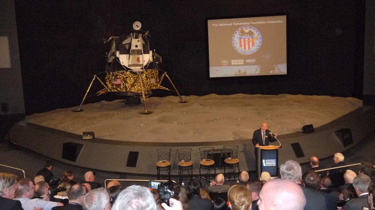 CAPE CANAVERAL, Fla. -- The Astronaut Scholarship Foundation helps celebrate the 40th anniversary of Apollo 16's lunar landing, which occurred April 20, 1972, with a soiree at the Kennedy Space Center Visitor Complex's Saturn V Center. Addressing the audience is Apollo 8 Command Module Pilot and Apollo 13 Commander Jim Lovell. The 11-day Apollo 16 mission featured three moonwalks, including a nearly 17-mile lunar rover road trip to collect more than 200 pounds of moon rocks to return to Earth.        Photo credit: NASA/Chris Chamberland