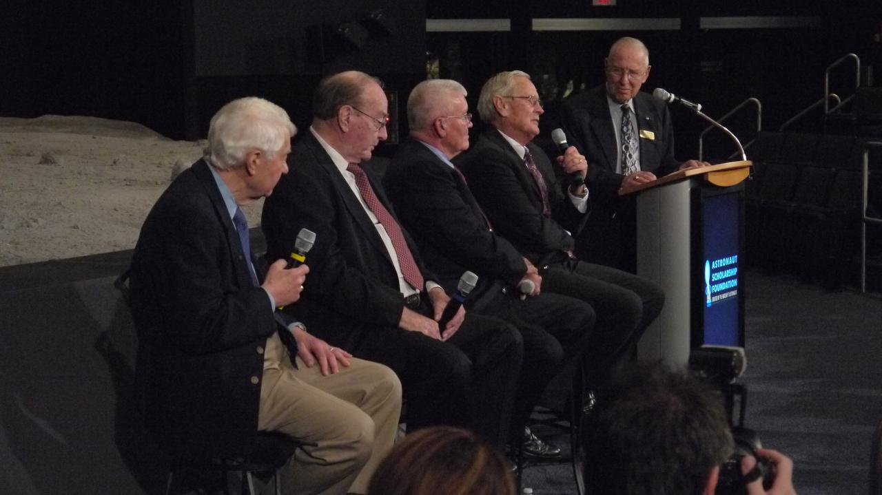 CAPE CANAVERAL, Fla. -- The Astronaut Scholarship Foundation helps celebrate the 40th anniversary of Apollo 16's lunar landing, which occurred April 20, 1972, with a soiree at the Kennedy Space Center Visitor Complex's Saturn V Center. Panel members who addressed the audience are, from left, astronaut support crew member for Apollo 16 Hank Hartsfield, Apollo 14 Lunar Module Pilot and Apollo 16 back-up crew member Edgar Mitchell, Apollo 13 Lunar Module Pilot and Apollo 16 back-up crew member Fred Haise, Apollo 16 Lunar Module Pilot Charlie Duke, and Apollo 8 Command Module Pilot and Apollo 13 Commander Jim Lovell. The 11-day Apollo 16 mission featured three moonwalks, including a nearly 17-mile lunar rover road trip to collect more than 200 pounds of moon rocks to return to Earth. Photo credit: NASA/Chris Chamberland