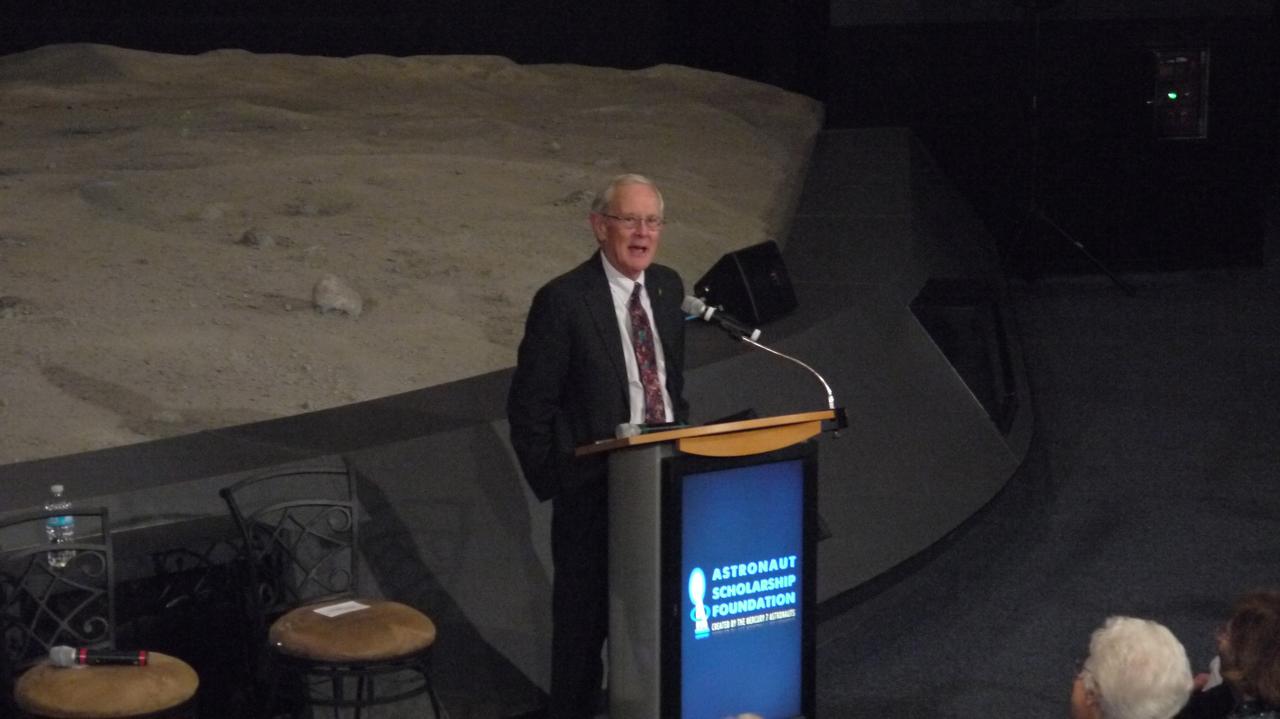 CAPE CANAVERAL, Fla. -- Apollo 16 Lunar Module Pilot Charlie Duke addresses the audience at the 40th anniversary celebration of Apollo 16's lunar landing, which occurred April 20, 1972. The Astronaut Scholarship Foundation hosted the soiree at the Kennedy Space Center Visitor Complex's Saturn V Center. The 11-day mission featured three moonwalks, including a nearly 17-mile lunar rover road trip to collect more than 200 pounds of moon rocks to return to Earth. Photo credit: NASA/Chris Chamberland